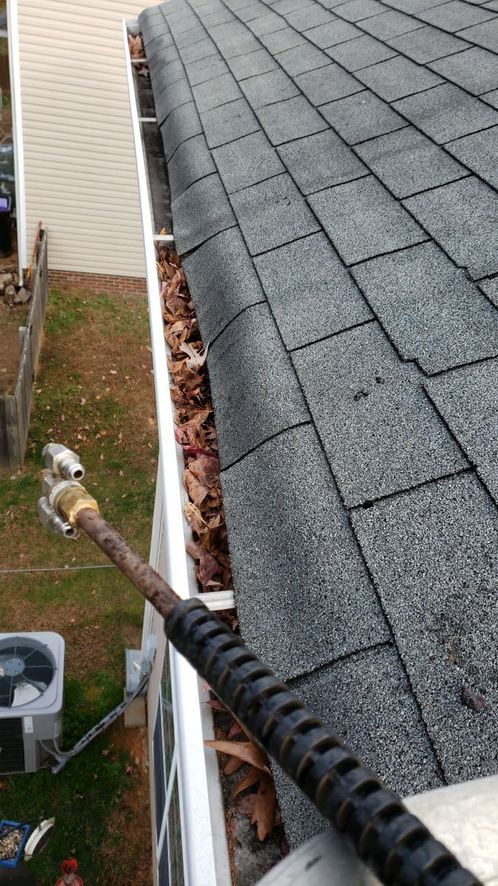 gutters and Driveway by Power Wash Masters LLC
