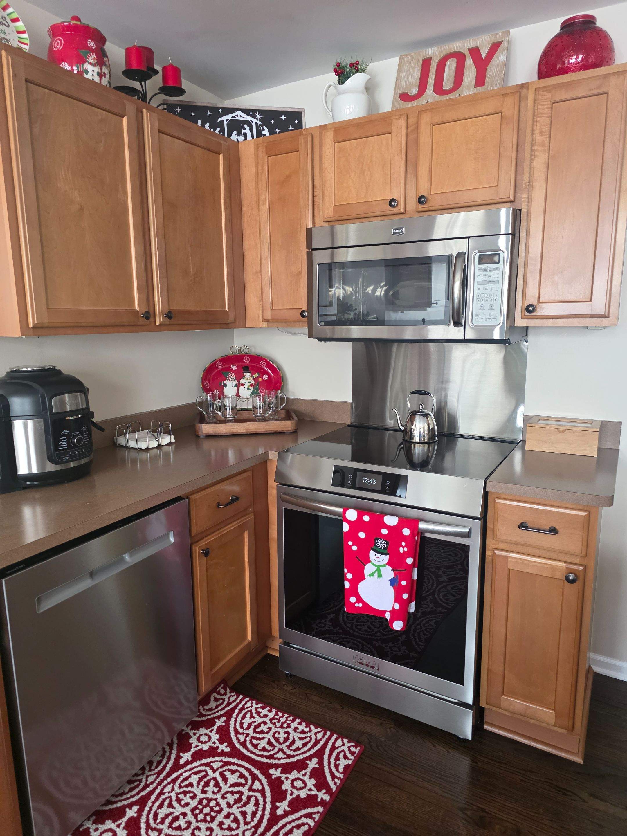 Two-Tone Kitchen Cabinet Refinishing in Sage Green and White by Top Shelf Painter