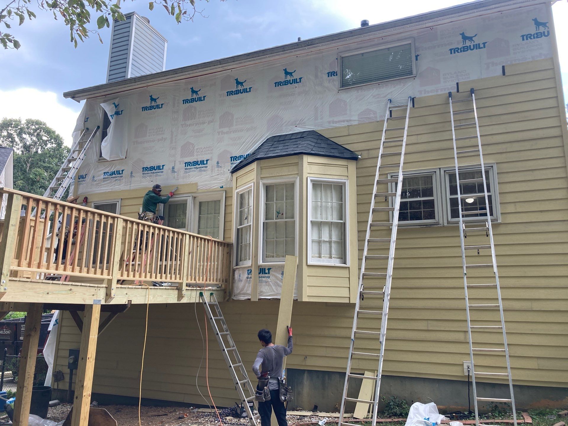 James Hardie Siding Replacement and Pressure Treated Pine Deck Resurface  by Nelson Exteriors 