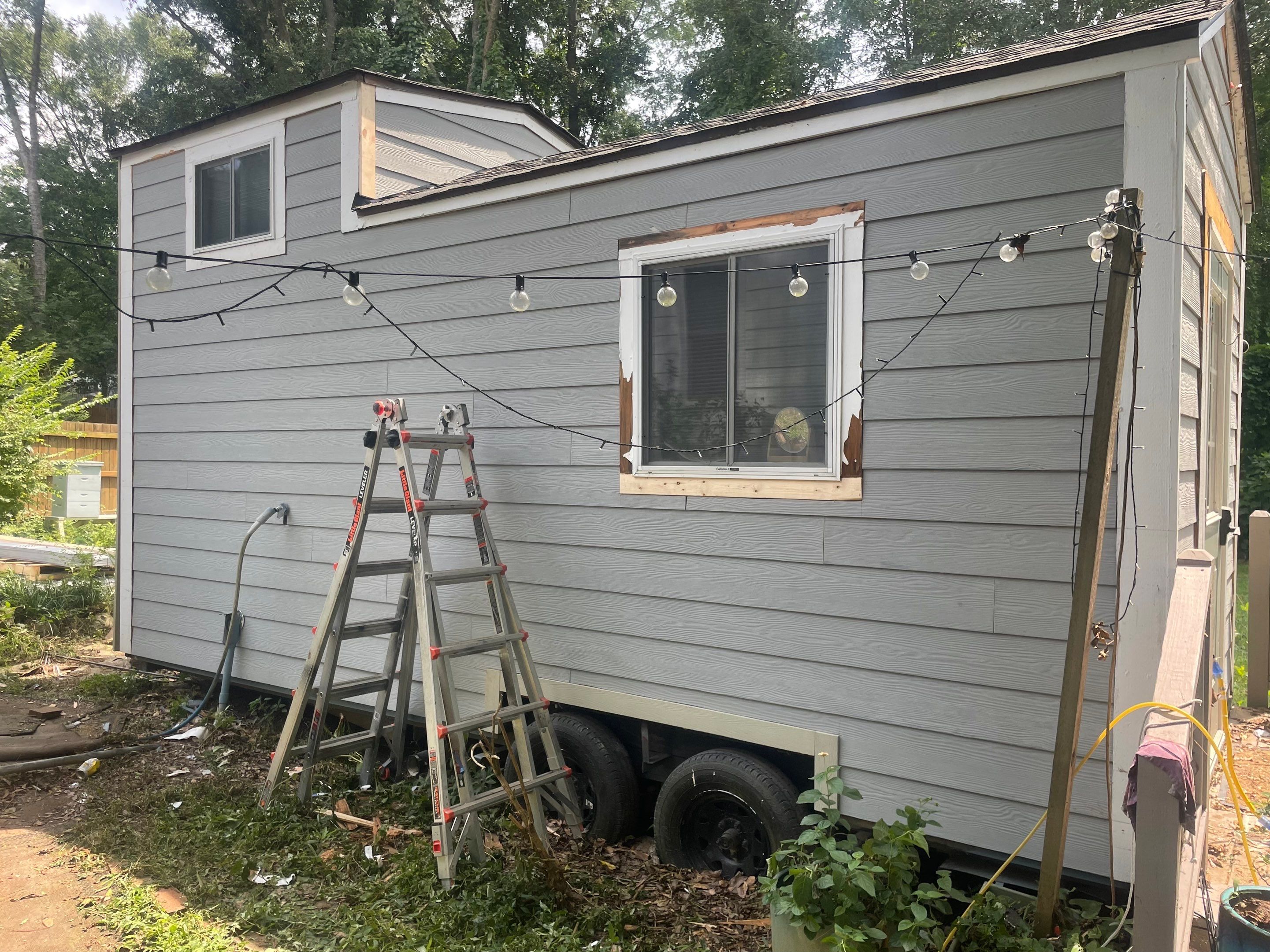 tiny home remodel- siding,paint,roofing by Nailed It Roofing & Remodeling LLC