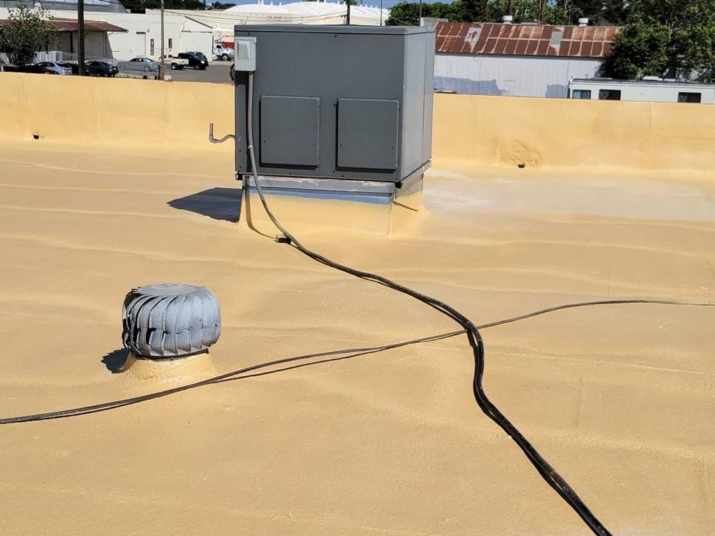 Spray foam and coatings using Conklin Benchmark/PUMA XL coatings and spray foam by Straight Edge Roofing Inc