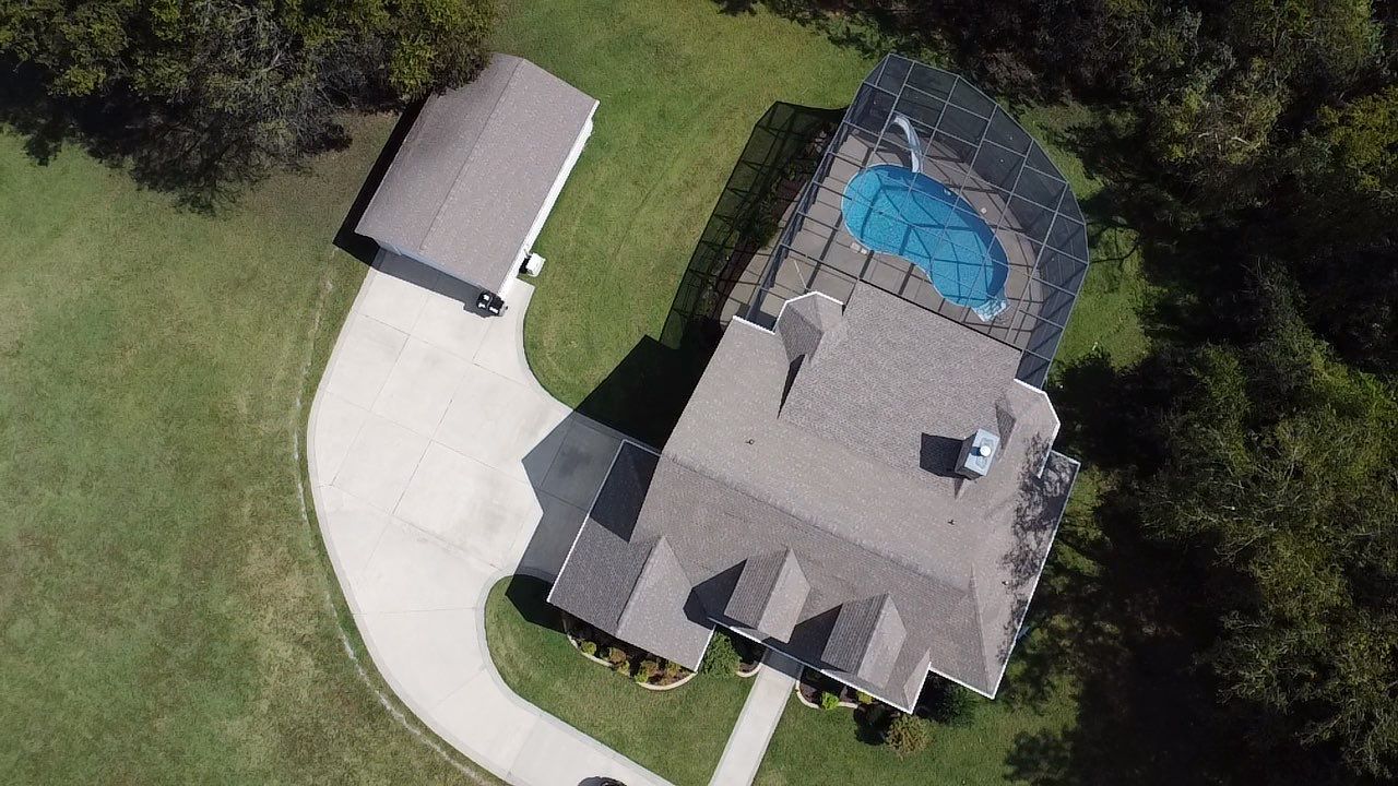 Roof and Gutter System Replacement with Stone Chimney Rebuild by Undersun Roofing 