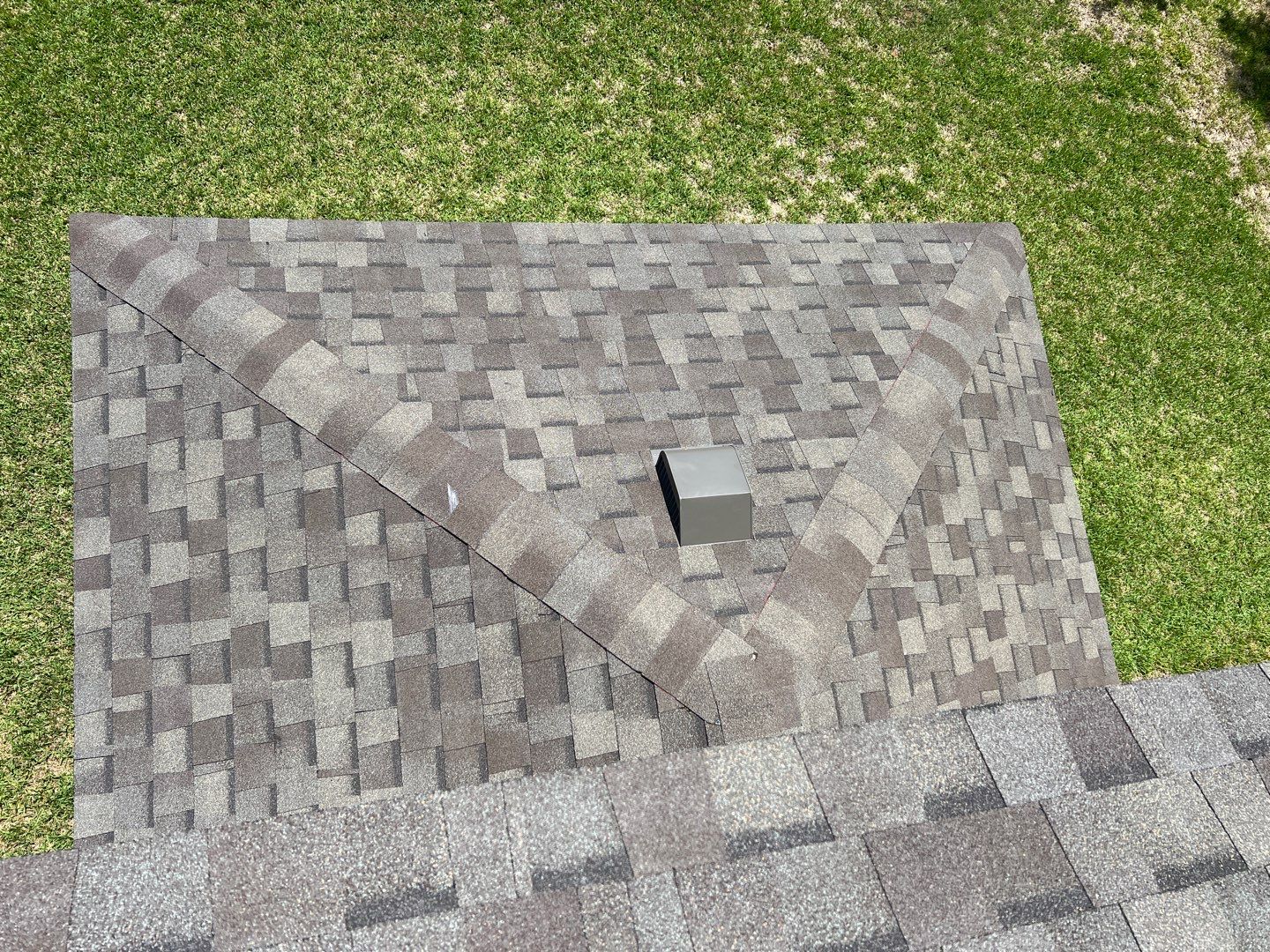 Wind damaged roof replacement by Oakwood Roofing and Construction, LLC