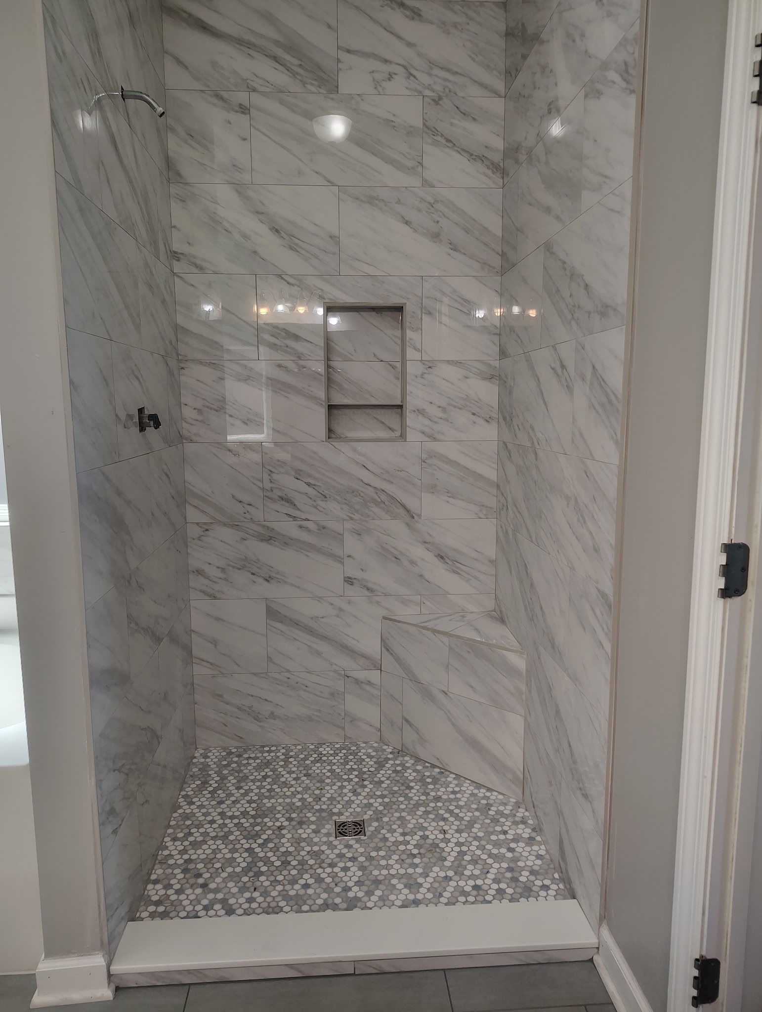 Tile shower remodel and heated floors by Footprints Floors of Nashville