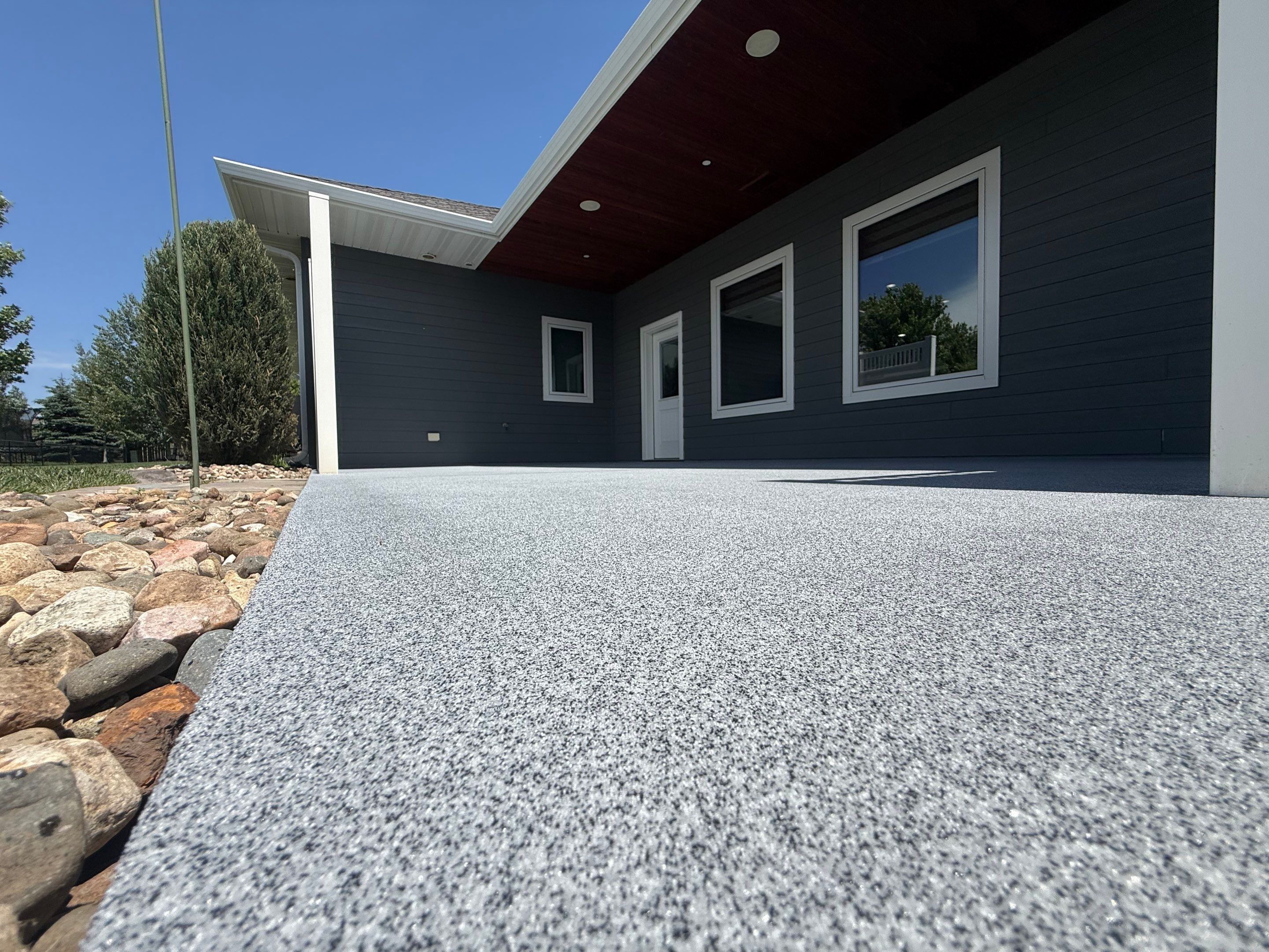 Polyurea Patio Floor Coating in Starry Evening for Sioux Falls Home by Select Painting, Coatings & Garage Cabinets