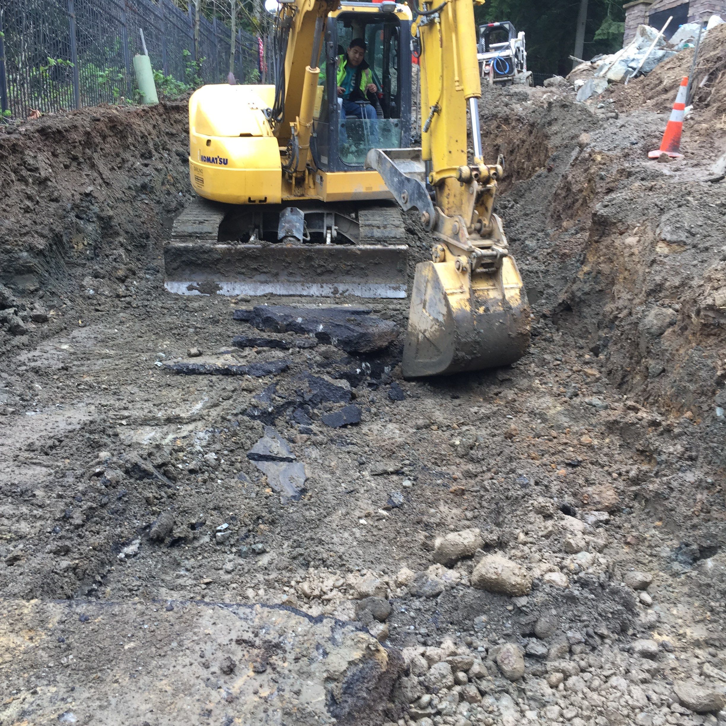 Asphalt Driveway and Stamped Concrete Patio Finish  by Jireh Asphalt & Concrete Inc 