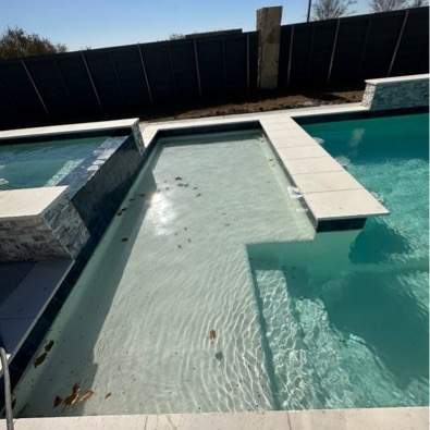 Geometric Pool with Raised Spa and Tanning Ledge by Pinnacle Pools and Spas - DFW