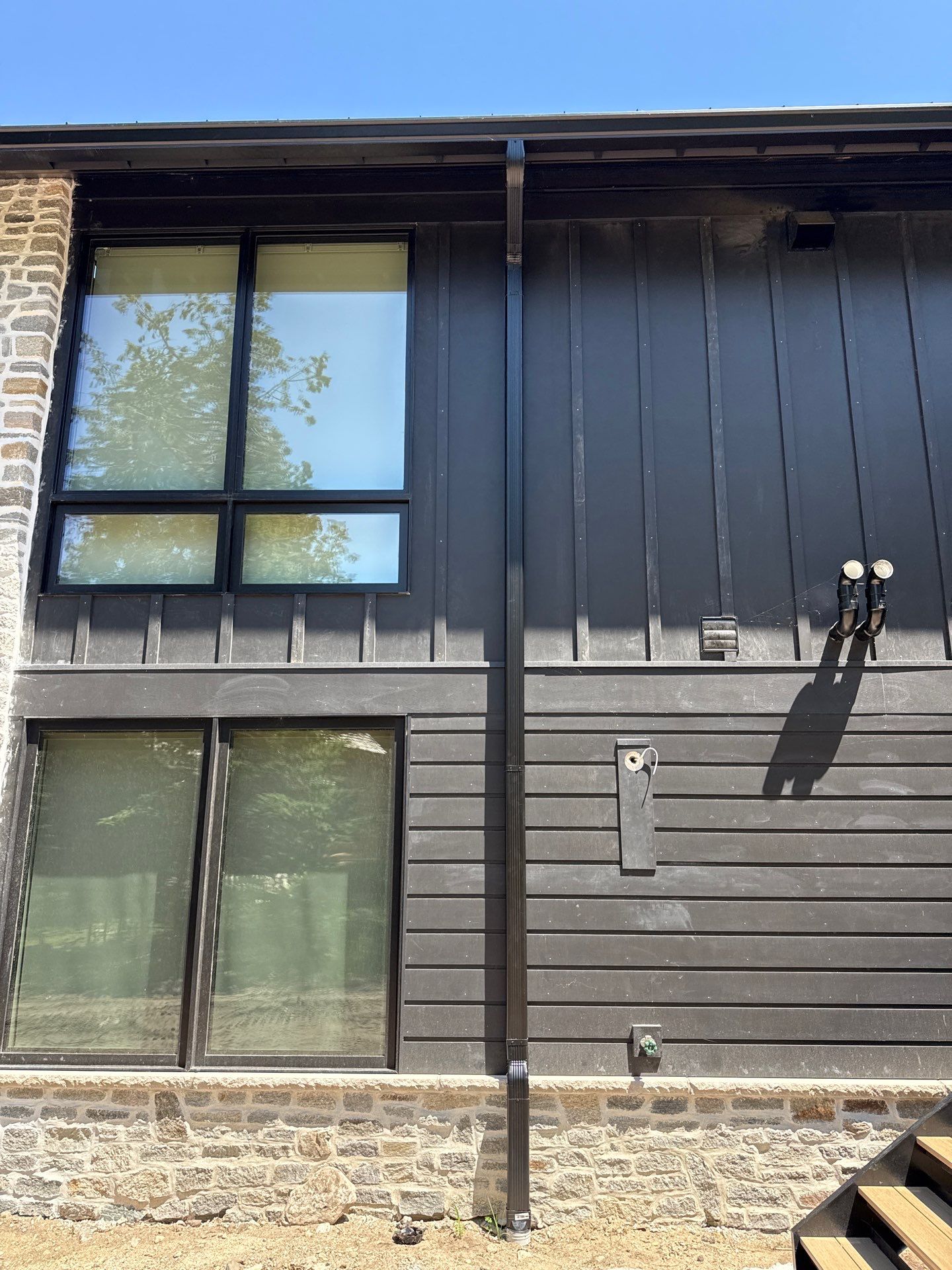 Gutter and Drainage System Installation for Modern Residential Build by Rainbow Seamless Systems