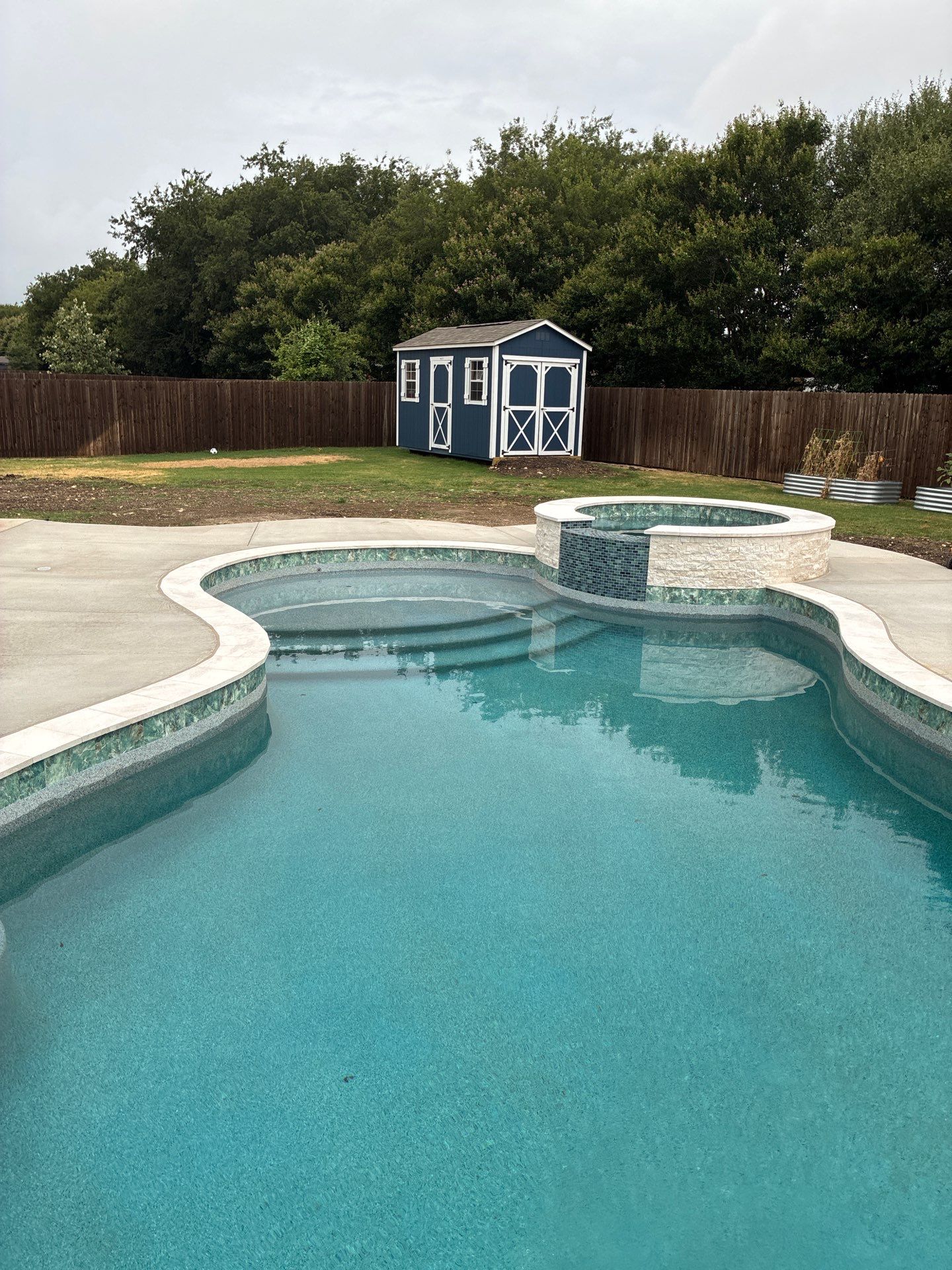 Freeform Pool with Raised Spa and Fire Feature by Pinnacle Pools and Spas - DFW