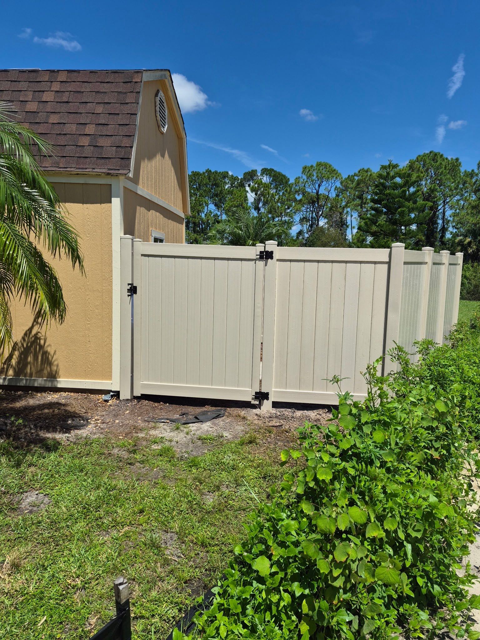 Tan Vinyl Privacy Fence Enclosure Installation in North Port by True Fence LLC