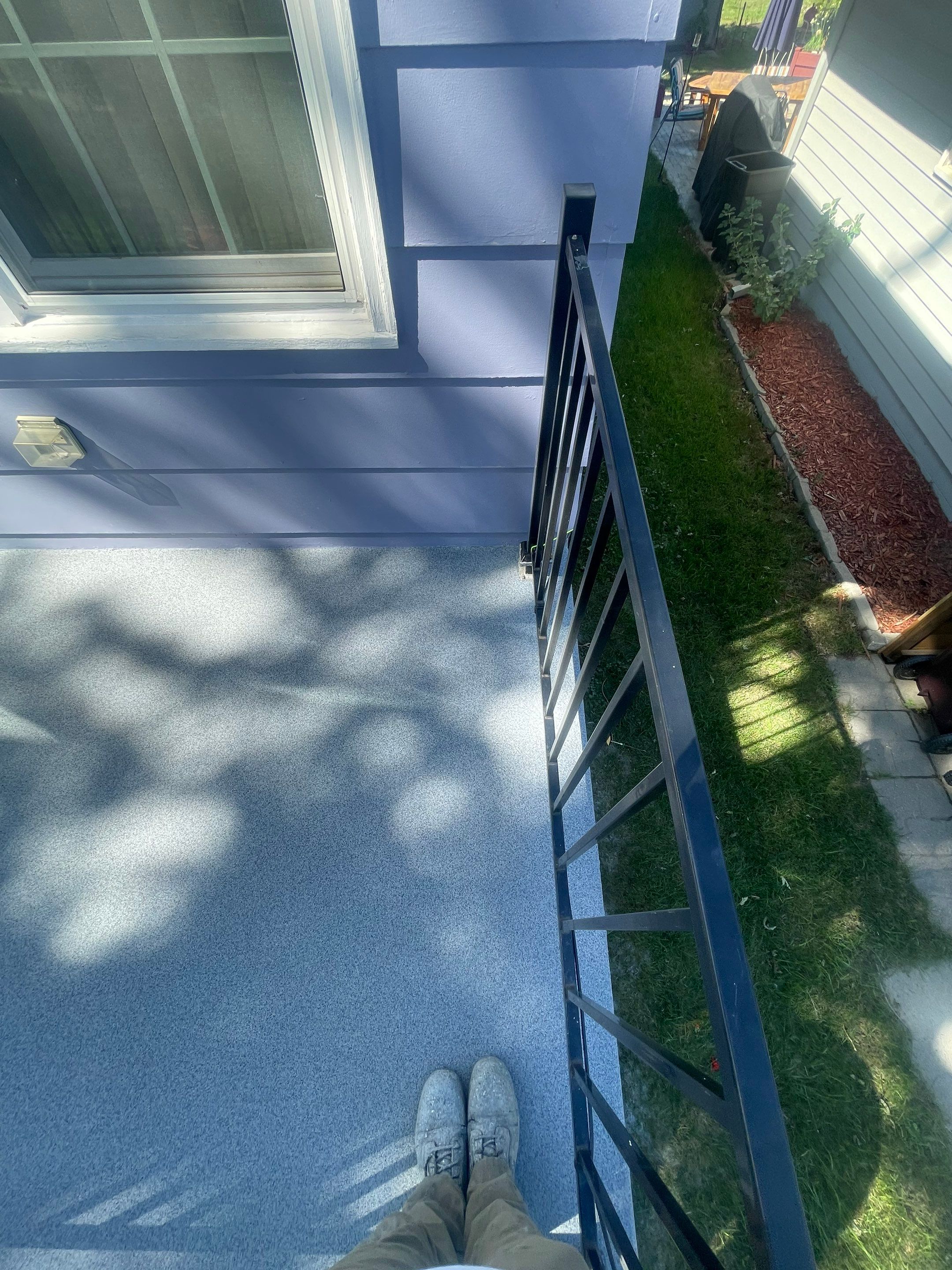 Sioux Falls Concrete Porch Coating with Starry Evening Finish by Select Painting, Coatings & Garage Cabinets
