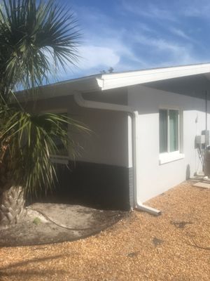 White Seamless Gutters with Matching Downspouts in Fort Myers Beach FL