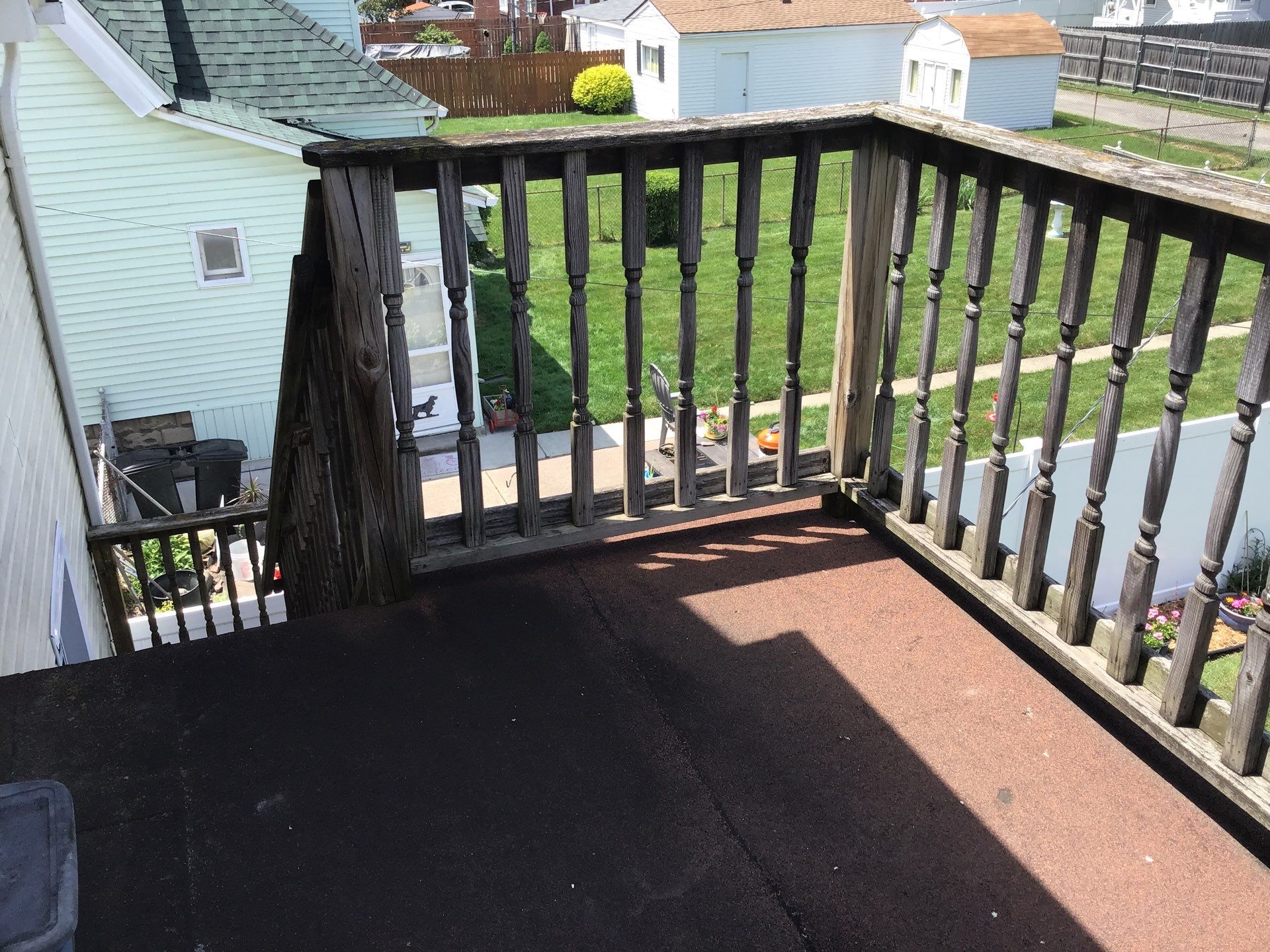 Rebuild balcony flat roofing TREX decking stairway and Railings in Wyandotte, MI by Northwest Construction 