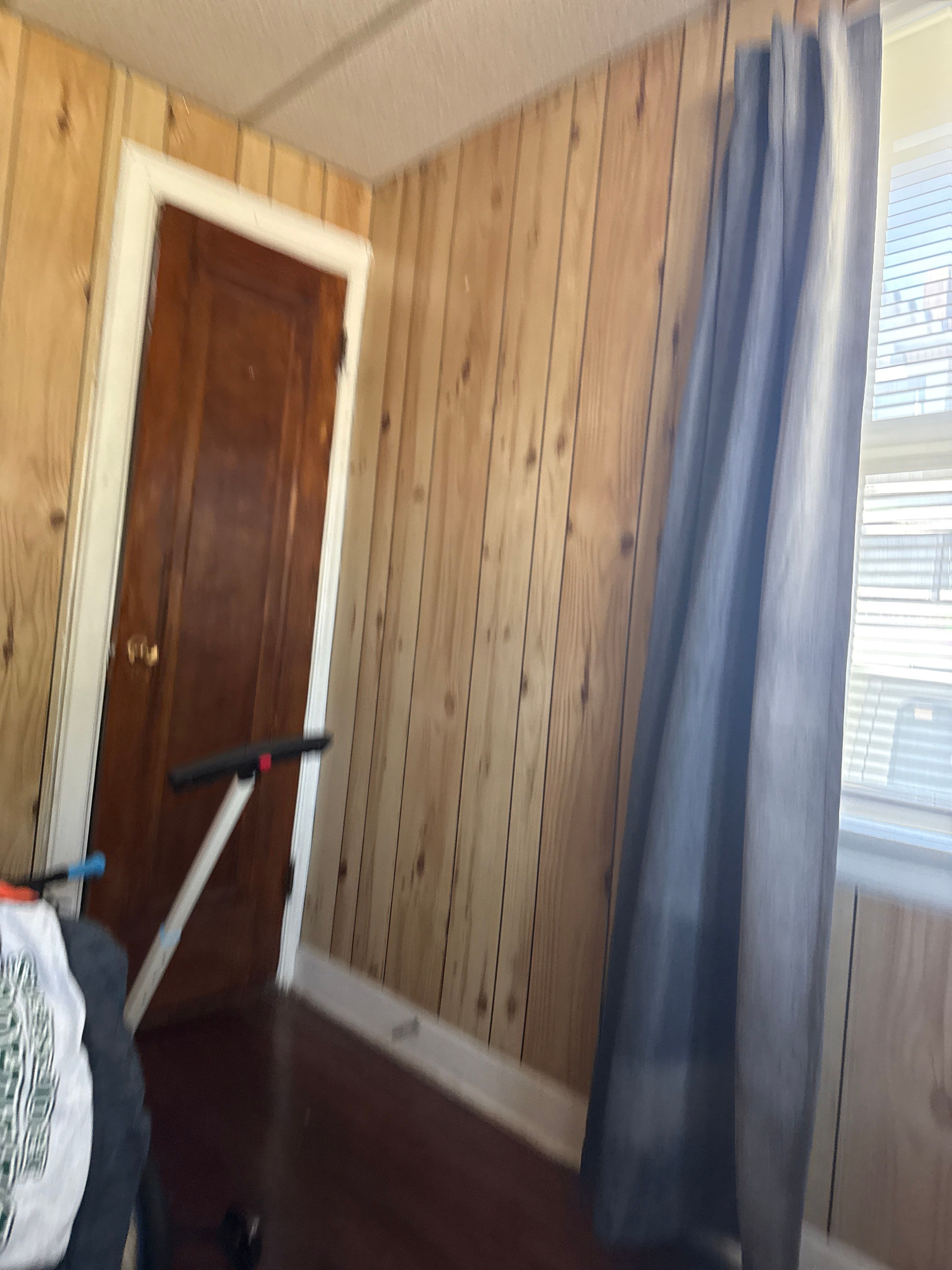 Commercial Office Remodel Featuring Knotty Pine Paneling and Hardwood Floors by CompanyCam Sales Demo