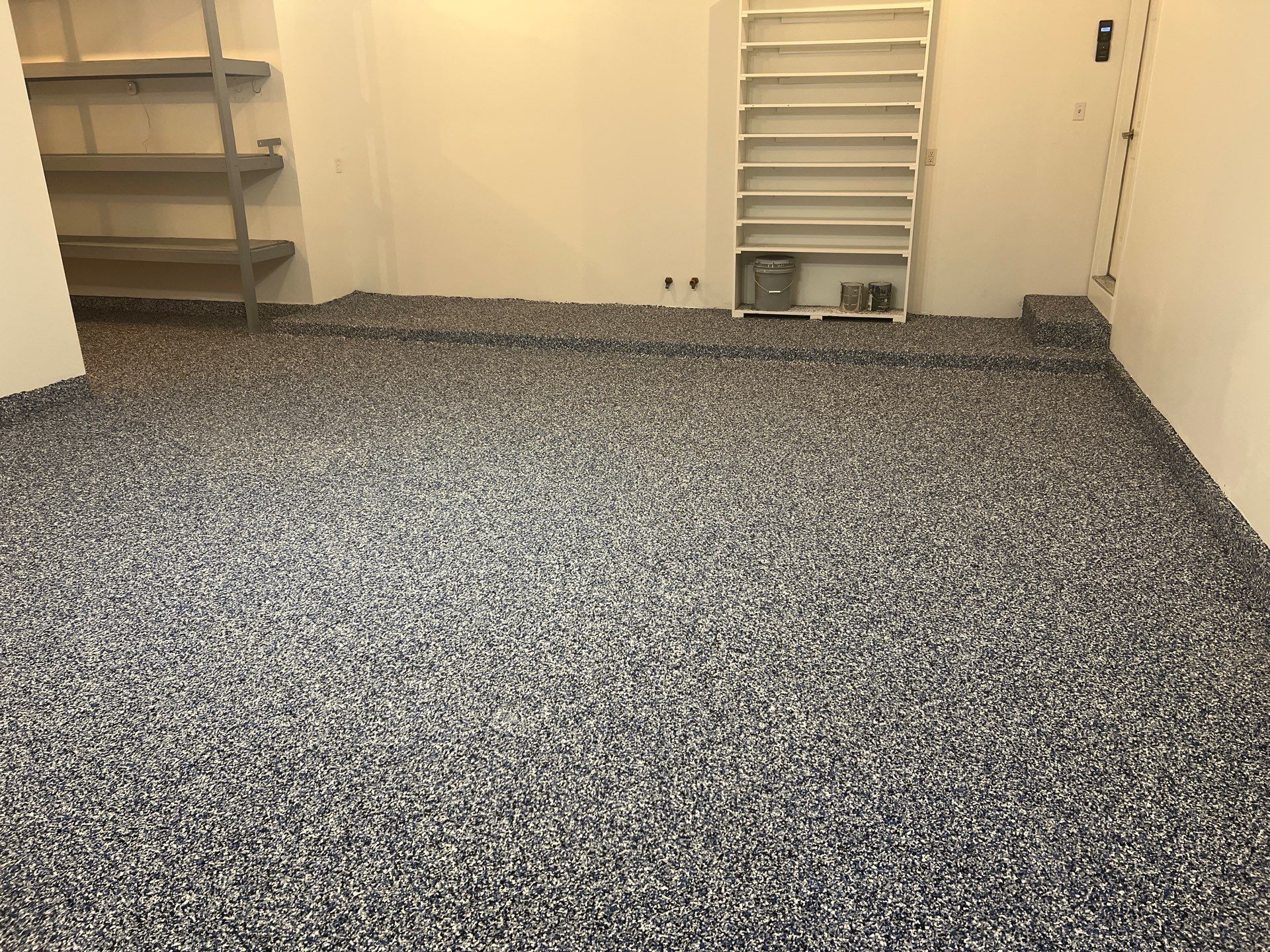 Custom Epoxy Flake Floor and Garage Wall Renovation in Ada by Gordon Painting