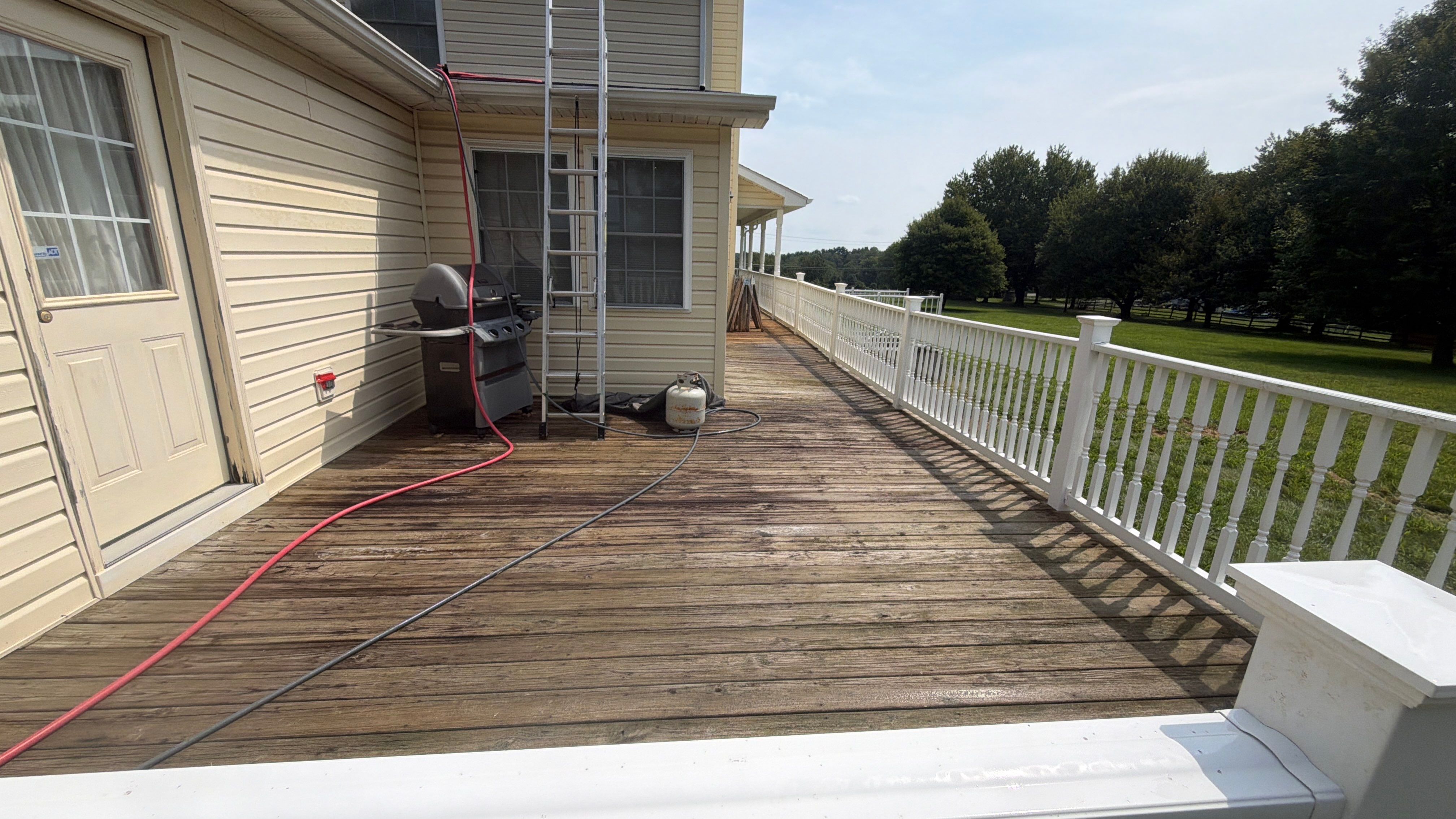 Vinyl Siding House Washing and Wood Deck Restoration in Carroll County by Baltimore Pressure Washers Inc.