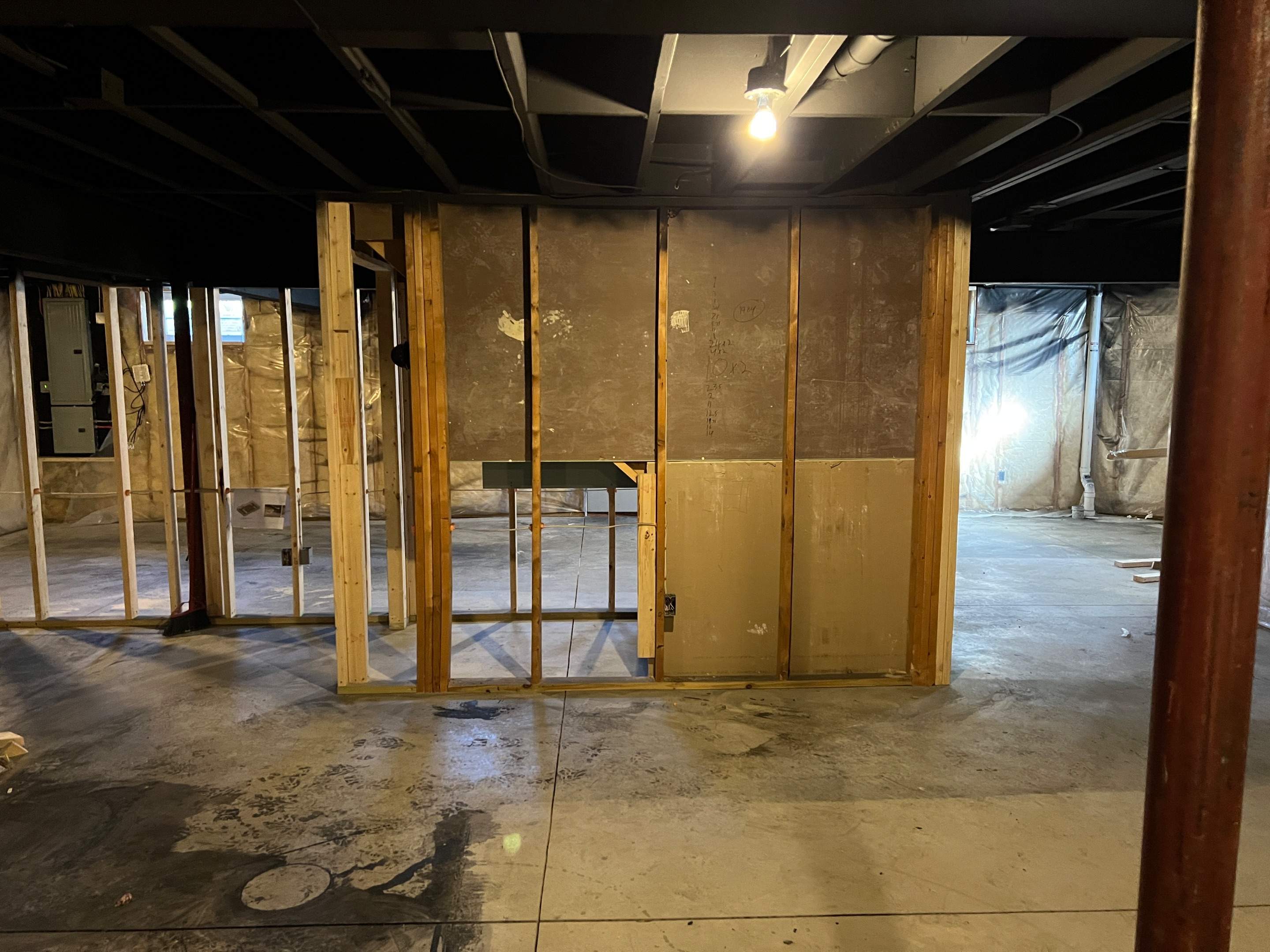 Basement Remodel w/ LVP Flooring & Exposed Ceiling by Chagnon Building & Remodeling LLC