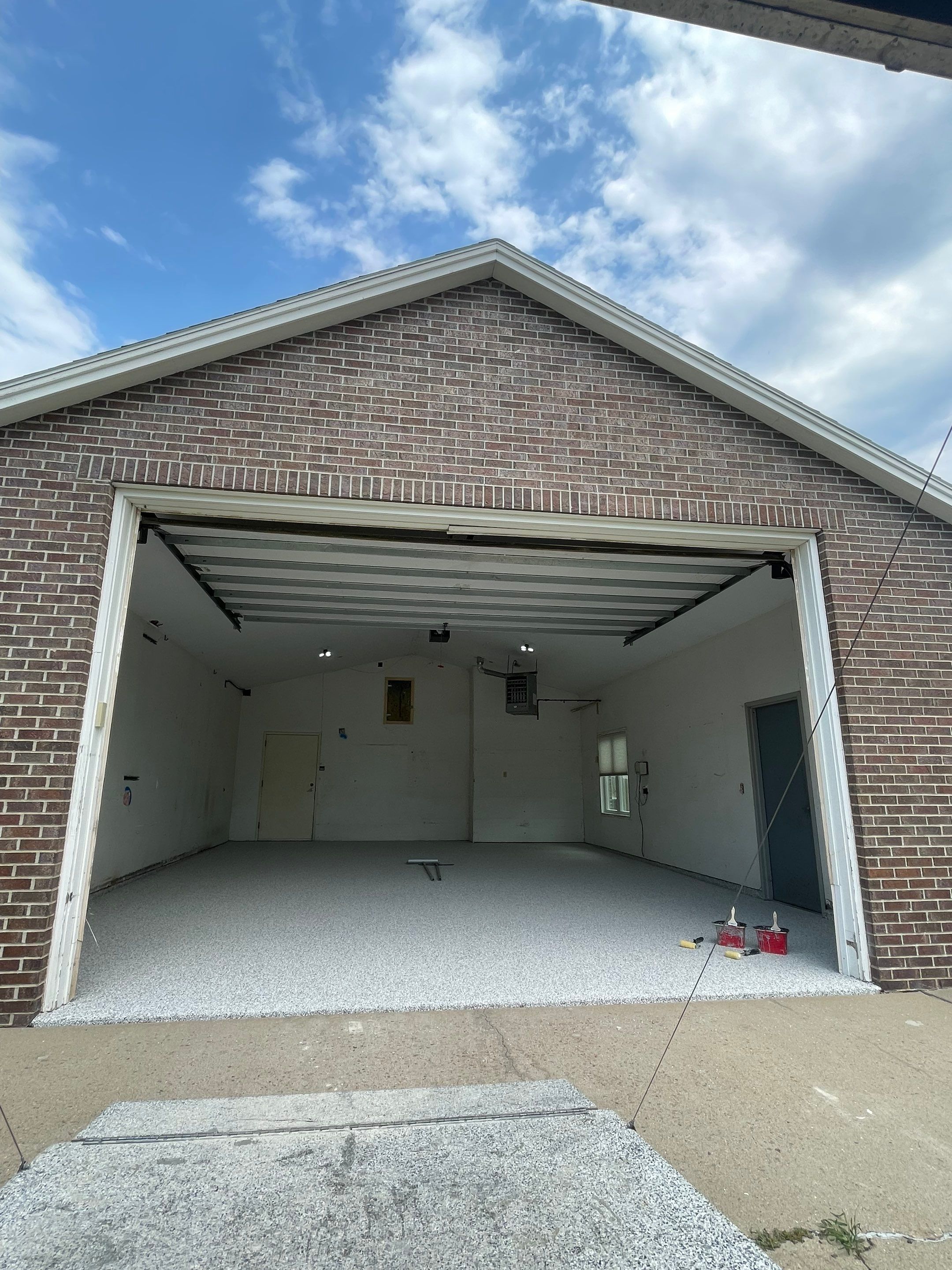 Coyote Flake Concrete Coating for Sioux Falls Garage by Select Painting, Coatings & Garage Cabinets