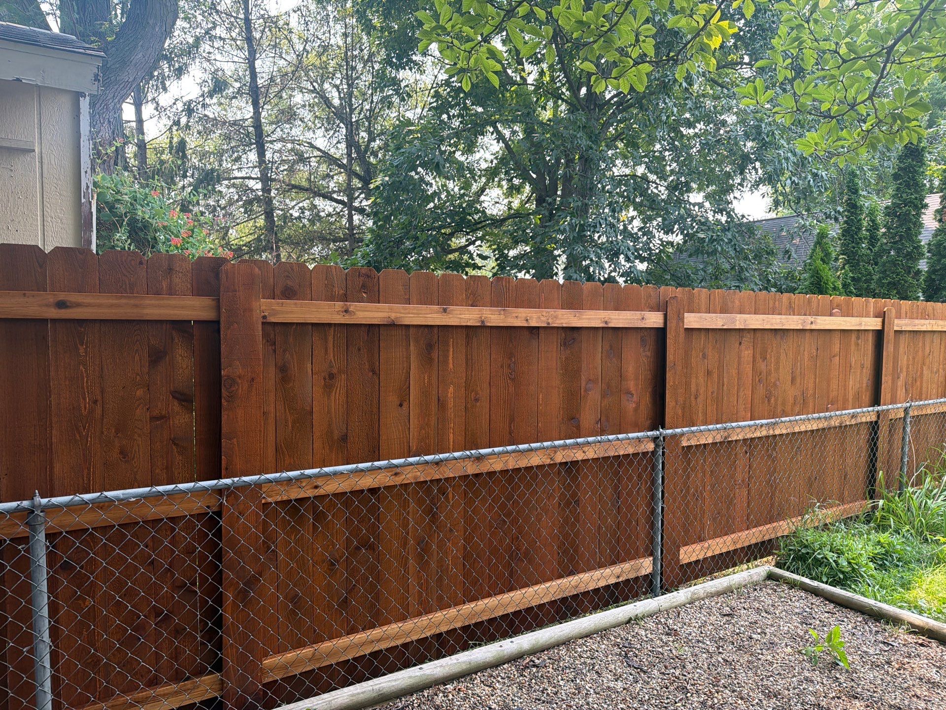 Pecan Cedar Privacy Fence Installation with Scalloped Top in Cedar Falls by Perfect Picket Fence and Stain