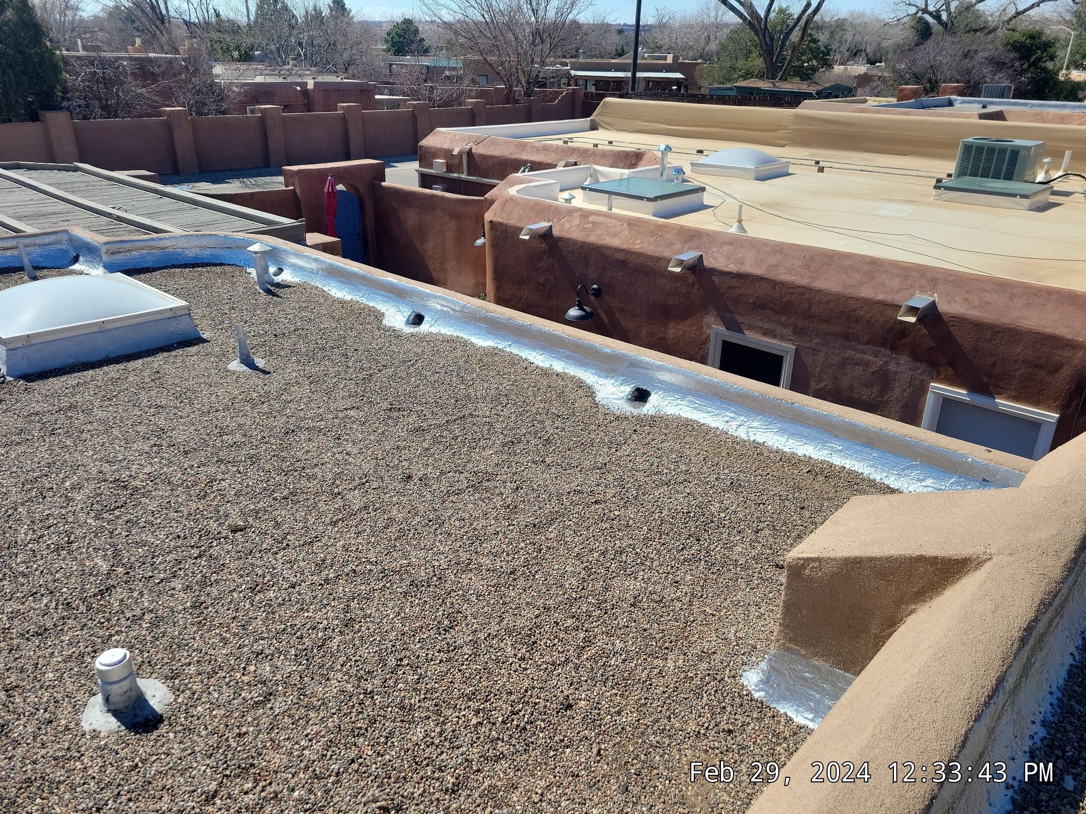 Roof Maintenance and Low-E Tempered Glass Skylight Replacement on Gravel Roof in Northwest Albuquerque by Doyle Roof Masters Inc