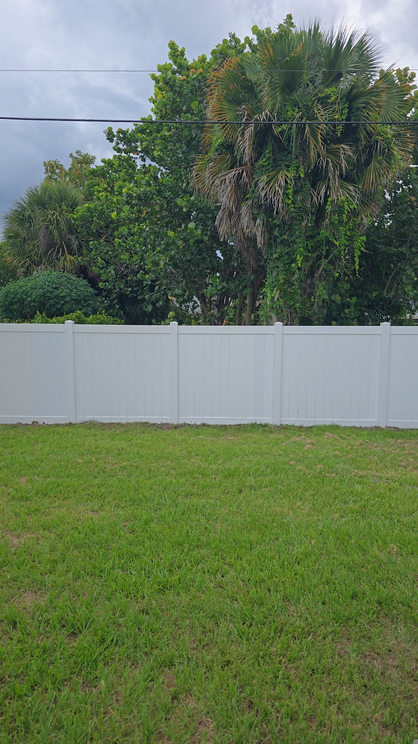 White Vinyl Privacy Fence Installation and Gate Repair in Port Charlotte by True Fence LLC