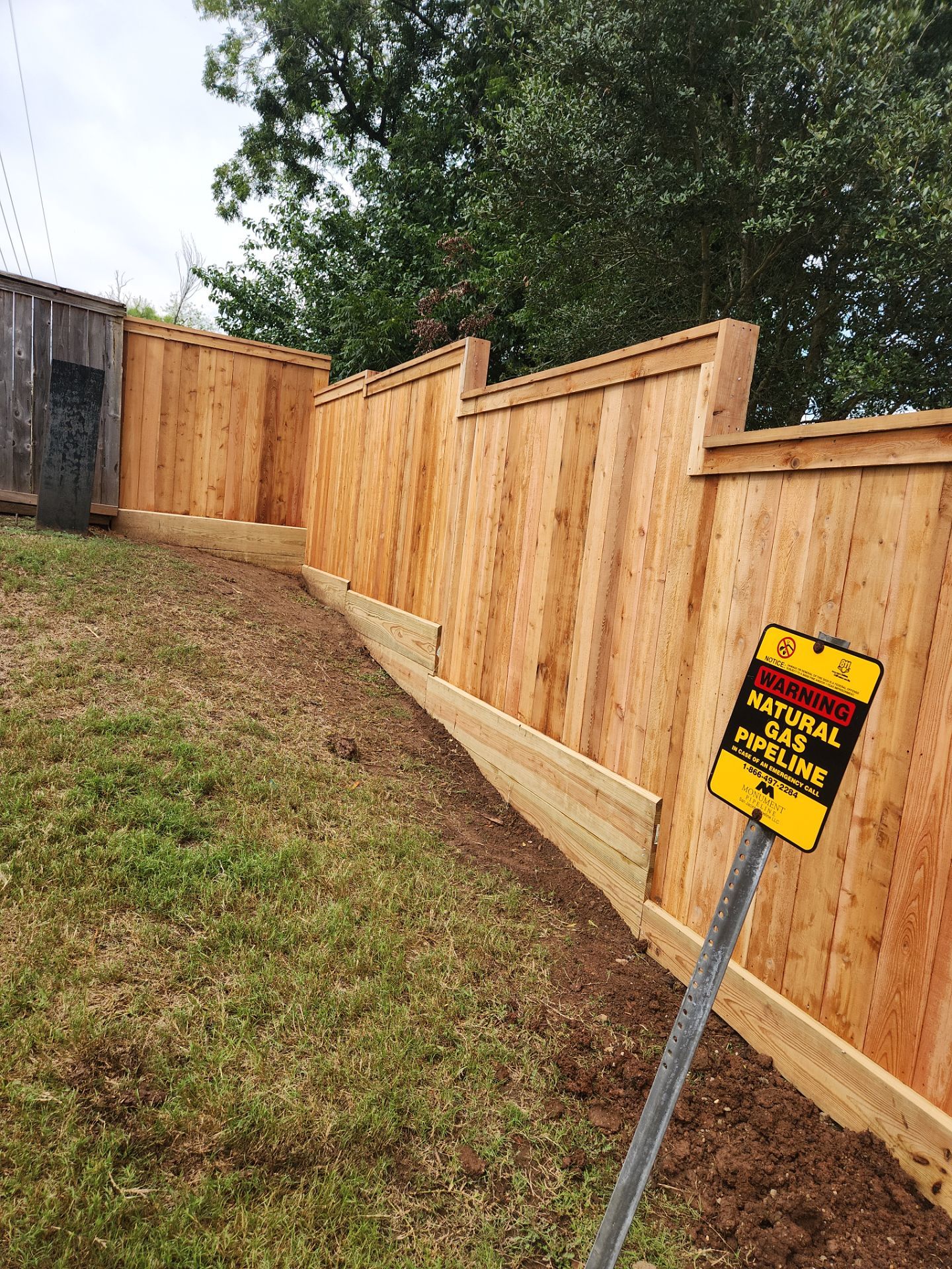 Wood Fence Installation for HOA by Tim's Fences