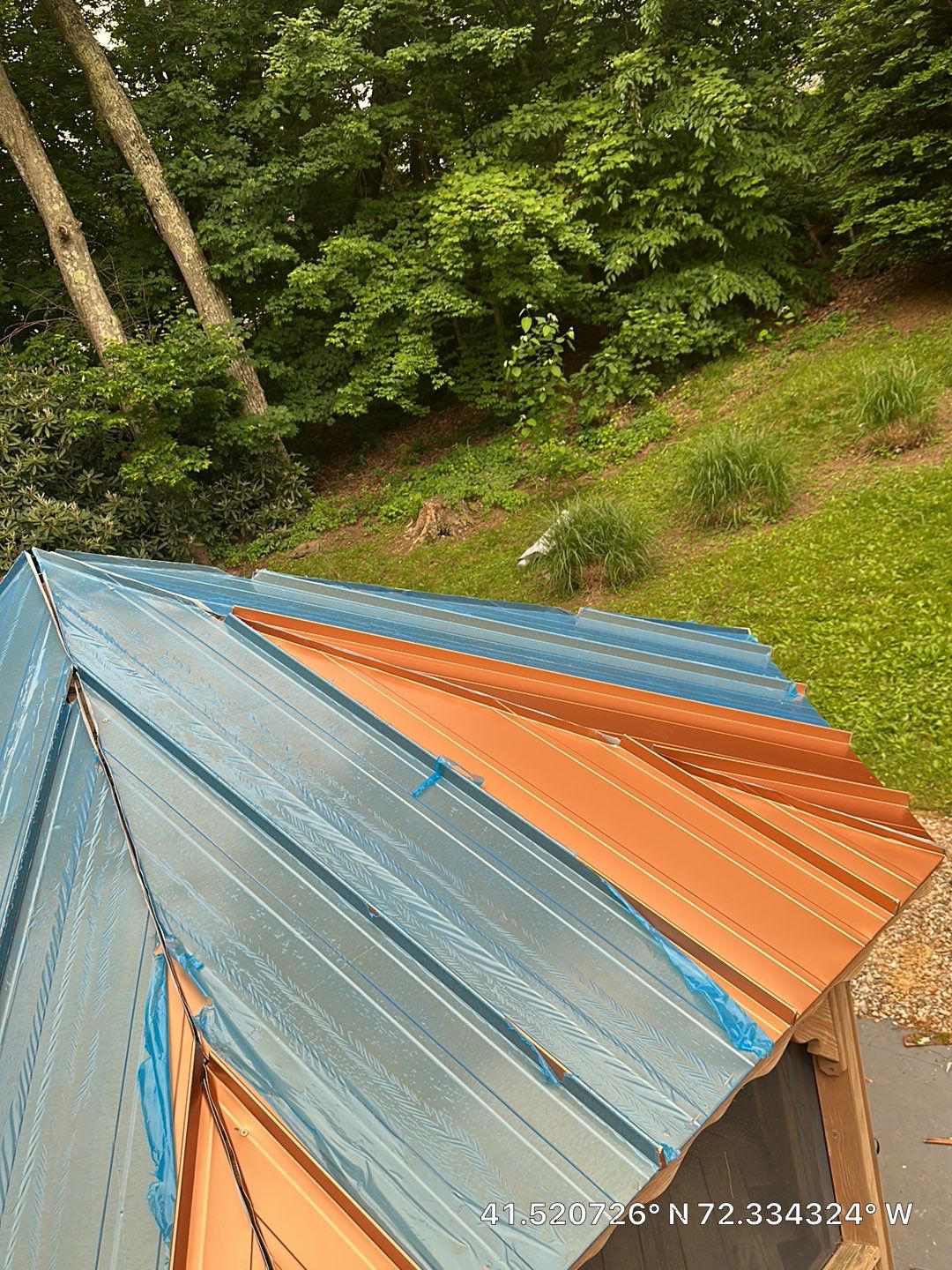 Residential Roofing Installation using Copper Penny Metal Roof by A Plus Exterior