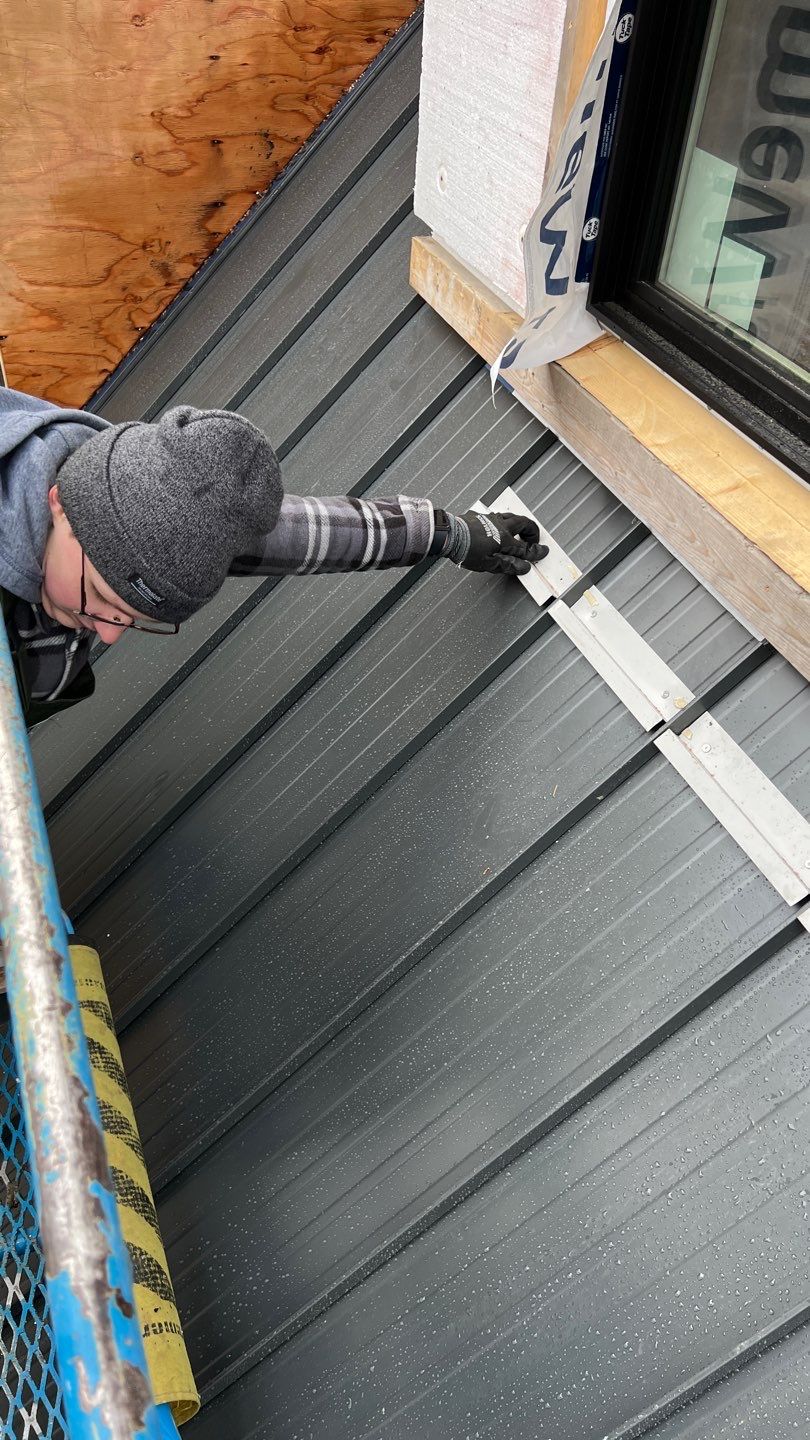 Residential Roofing Installation using 12" Prolok metal by Top Notch Roofing Inc