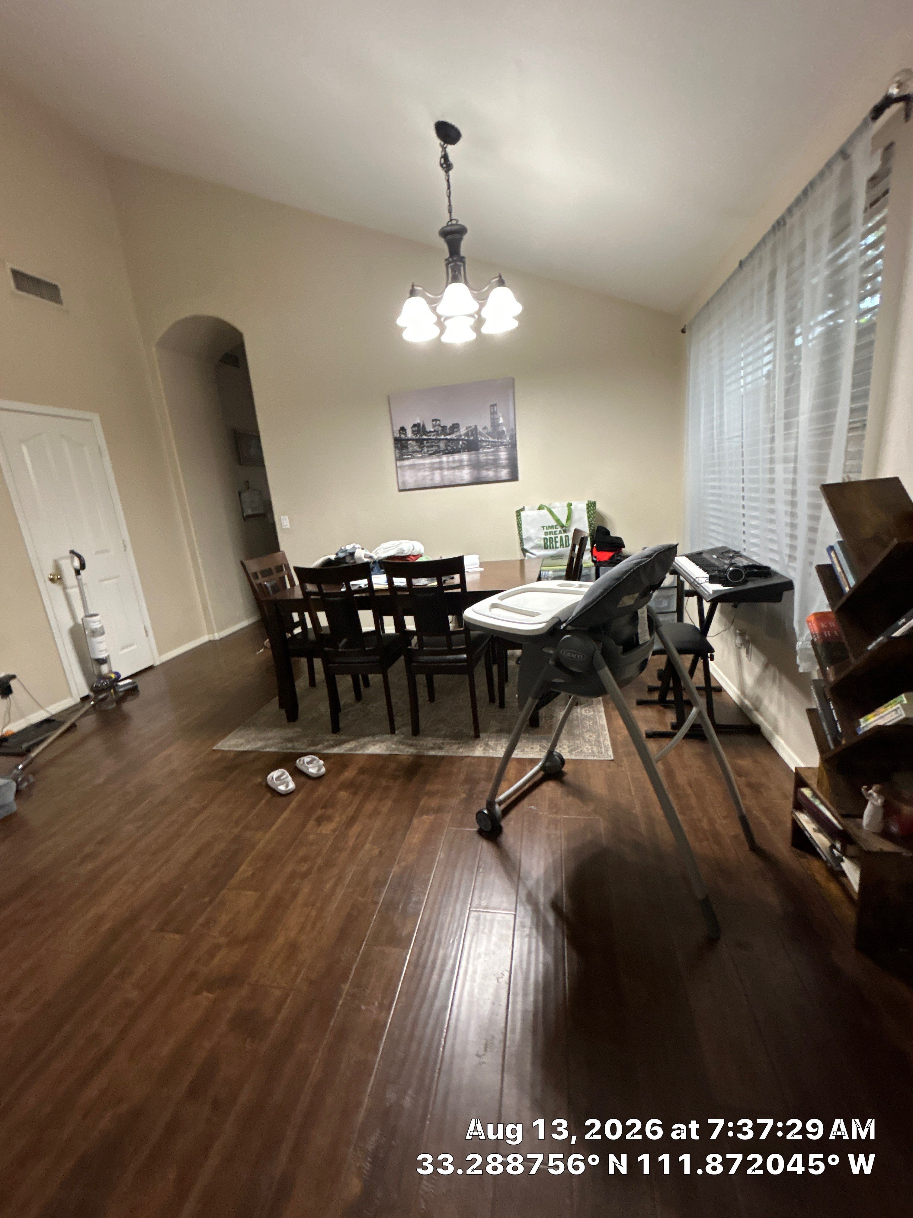 Dark Wood Laminate Flooring Installation in Chandler Dining Room by CompanyCam Sales Demo