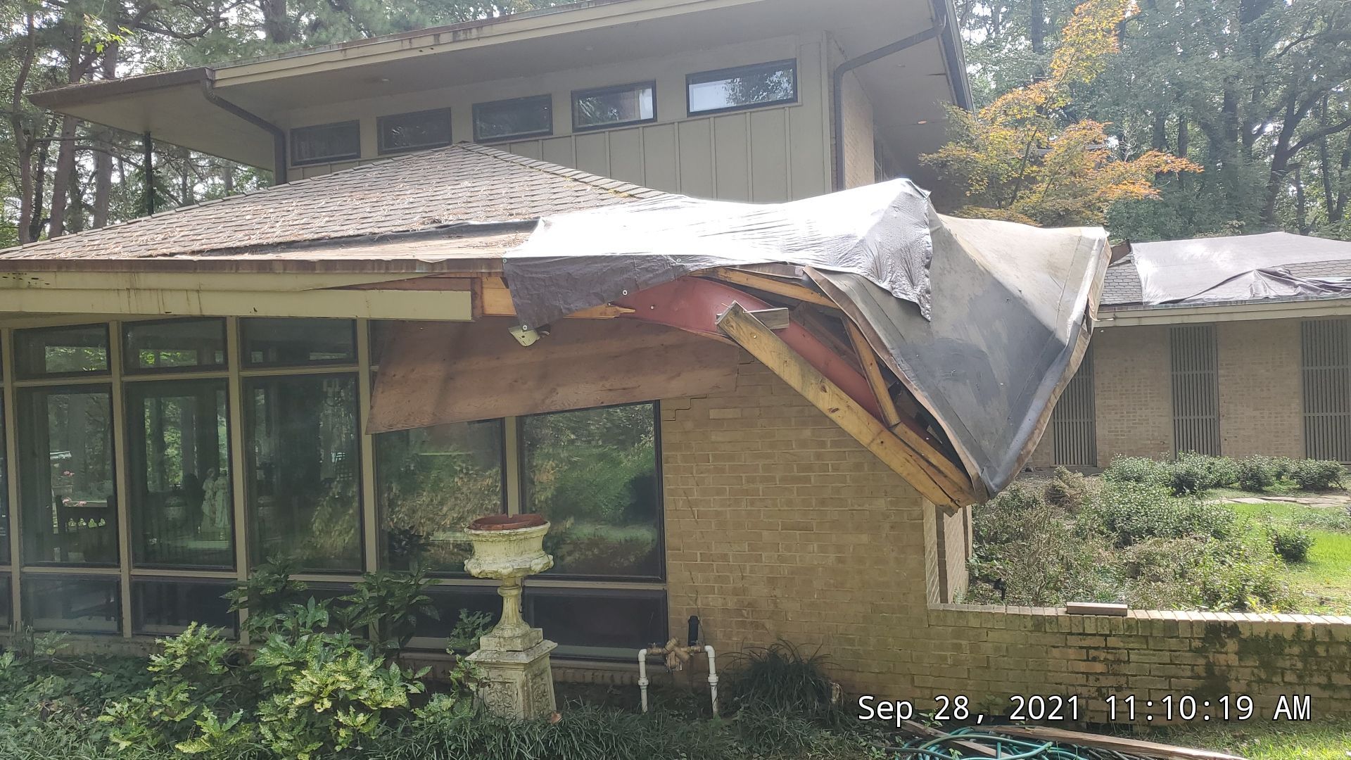 Residential Roofing Installation using PVC membrane and 24 gauge Standing Seam Metal by Hostetler Roofing