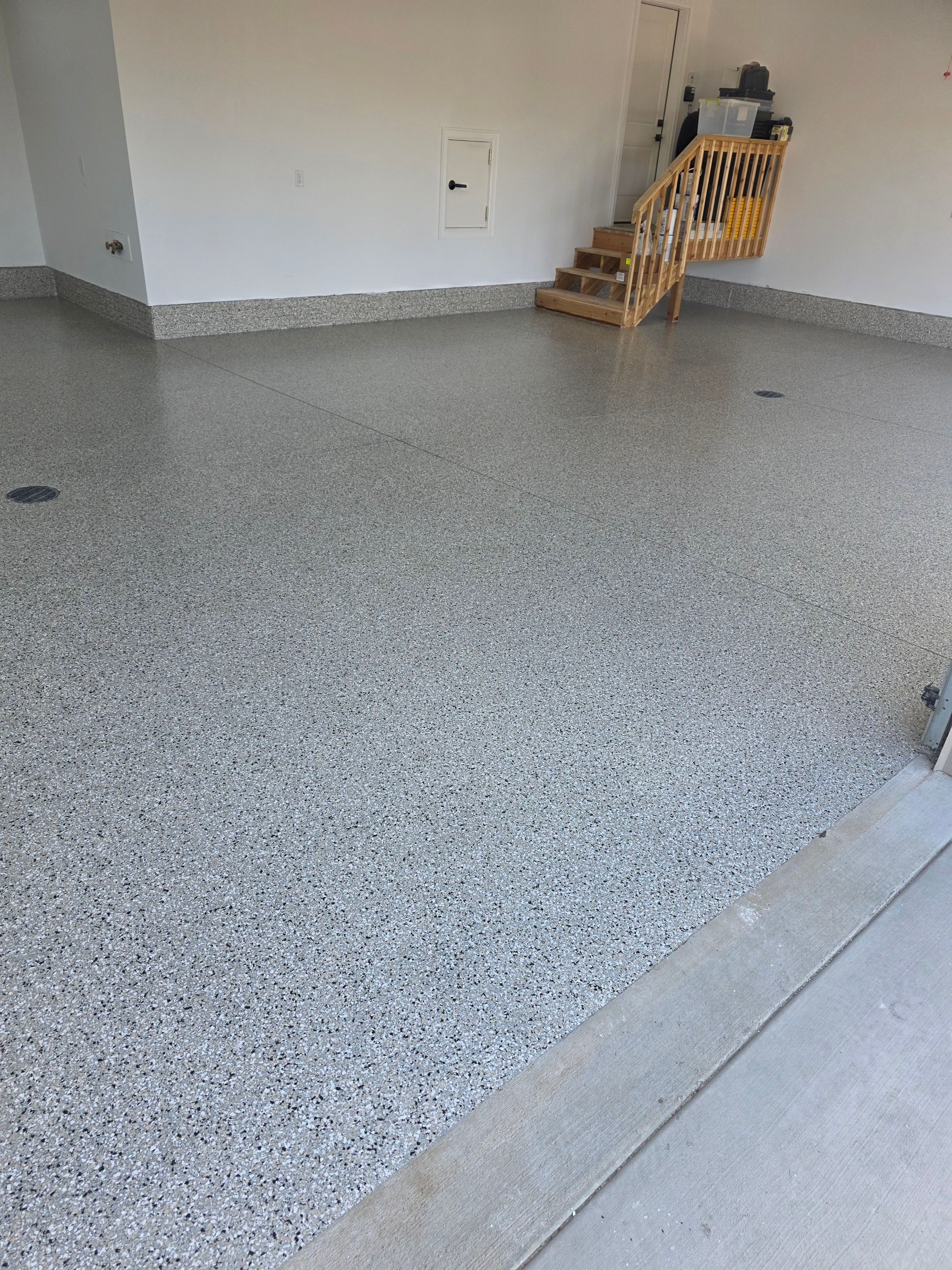Gray and Black Speckled Polyurea Garage Floor in Dell Rapids by Select Painting, Coatings & Garage Cabinets