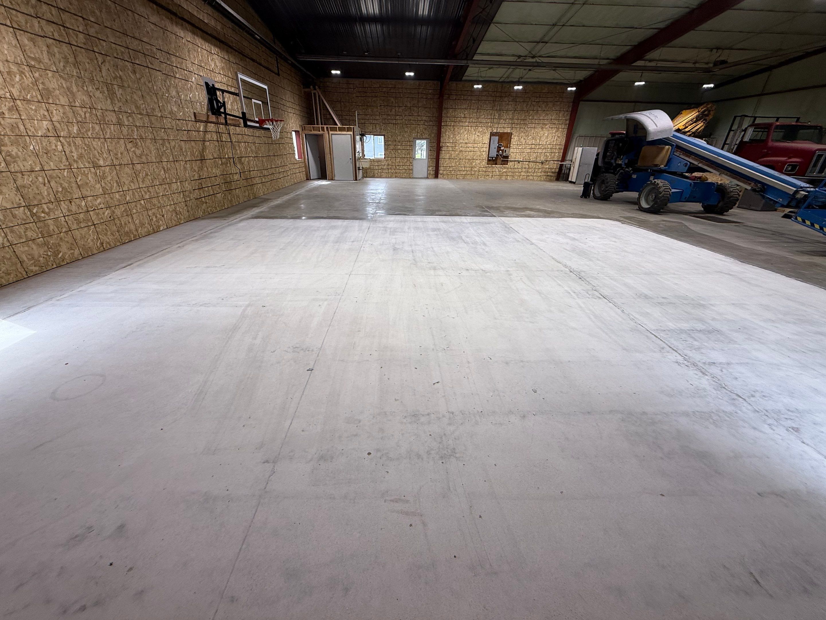 Custom Polyurea Shop Floor with Basketball Court Lines in Rock Valley by Select Painting, Coatings & Garage Cabinets