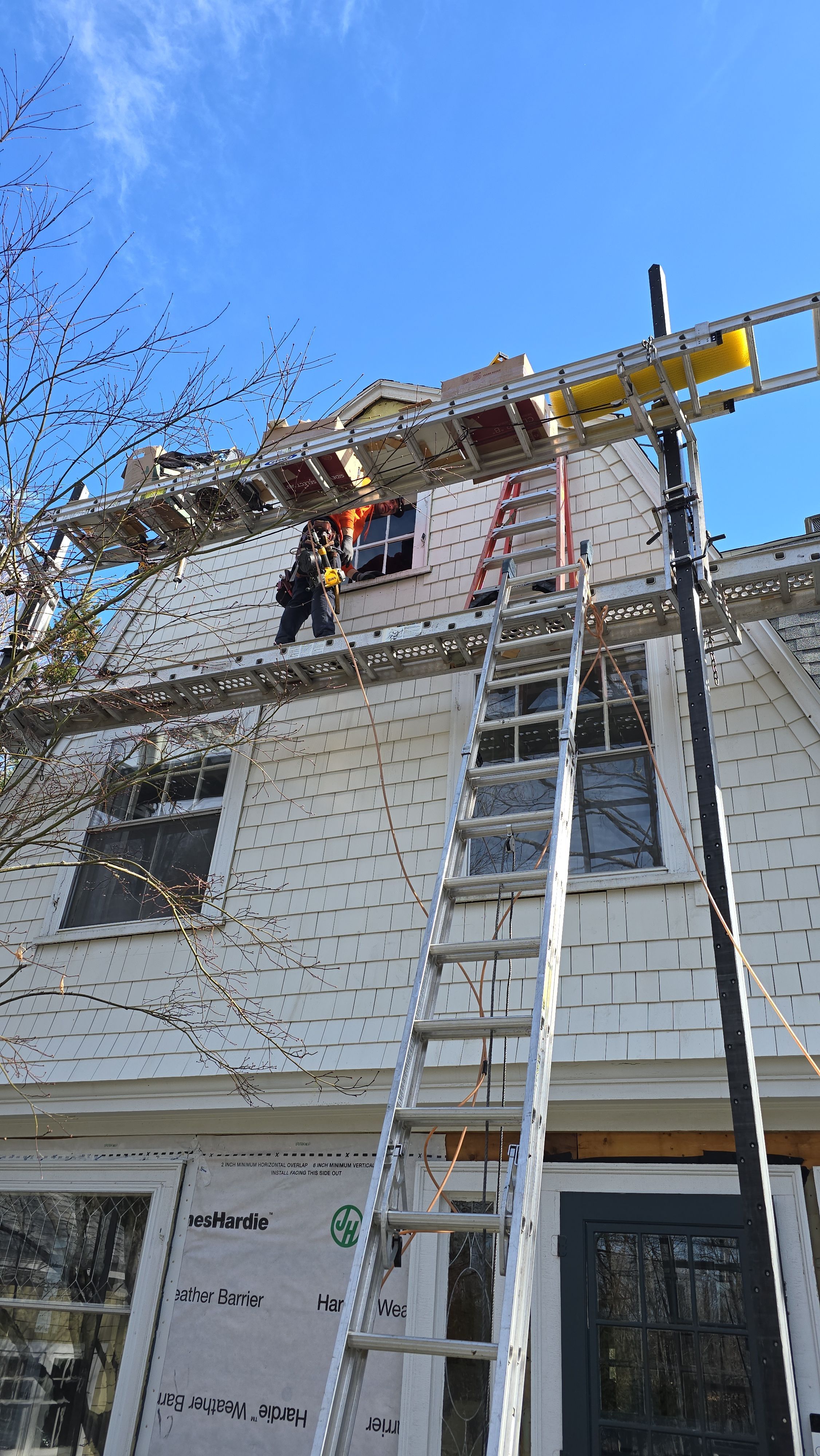 White cedar shingles and windows in Wayland, MA by UBrothers Construction