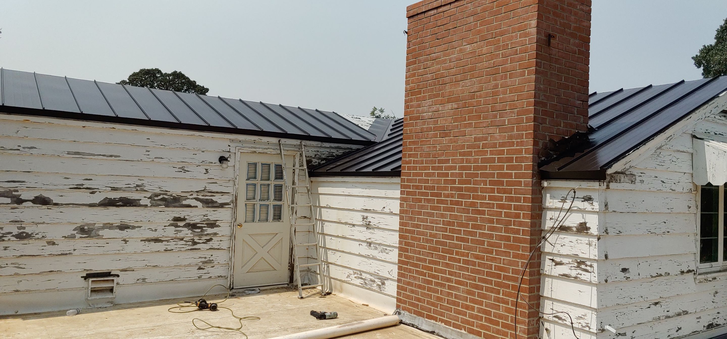 Residential Roofing Installation using Standing seam metal roofing system by Straight Edge Roofing Inc