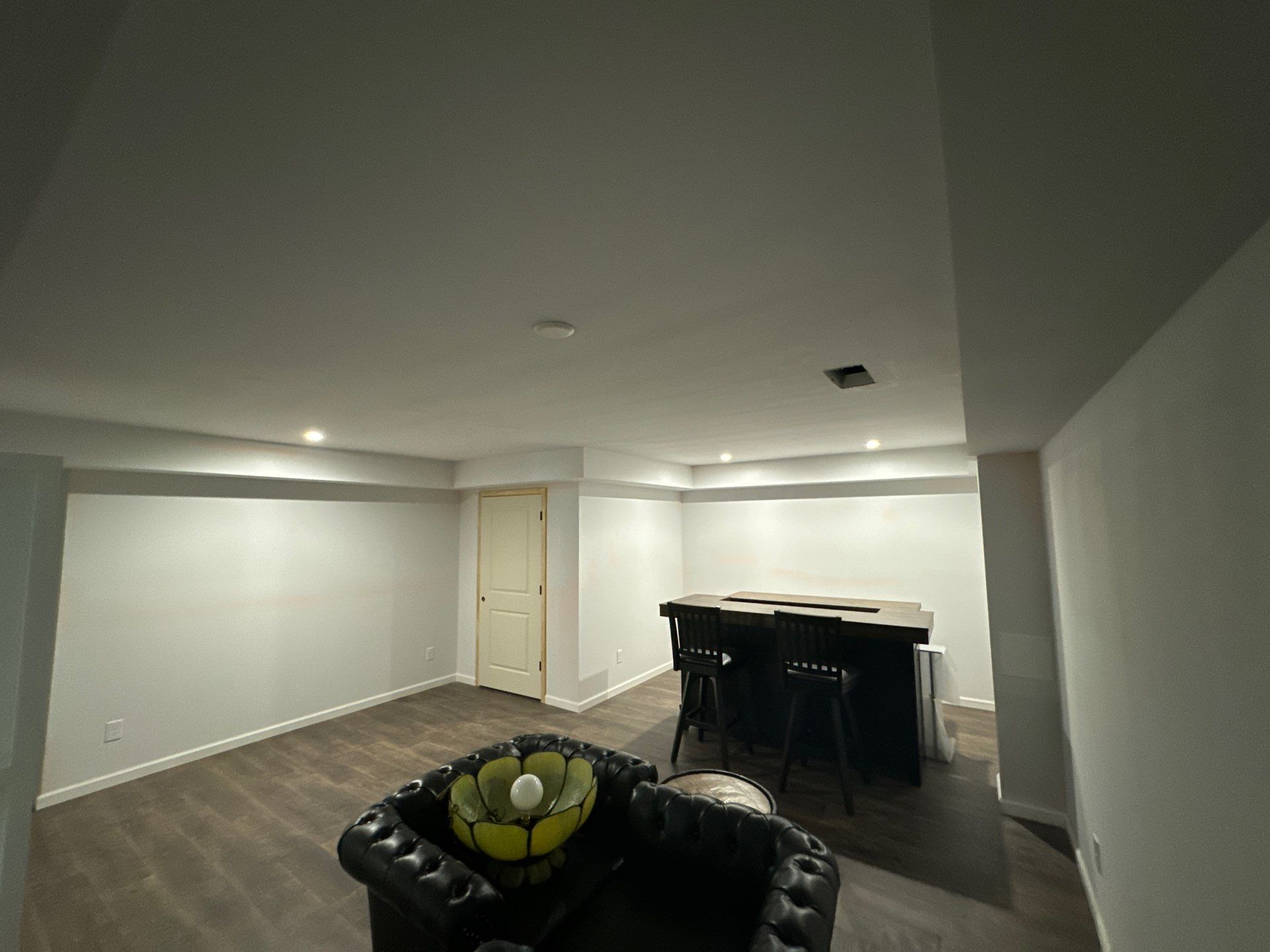 Finished Basement in Acworth Featuring a Full Bathroom and Bar by Swift Home Renovations