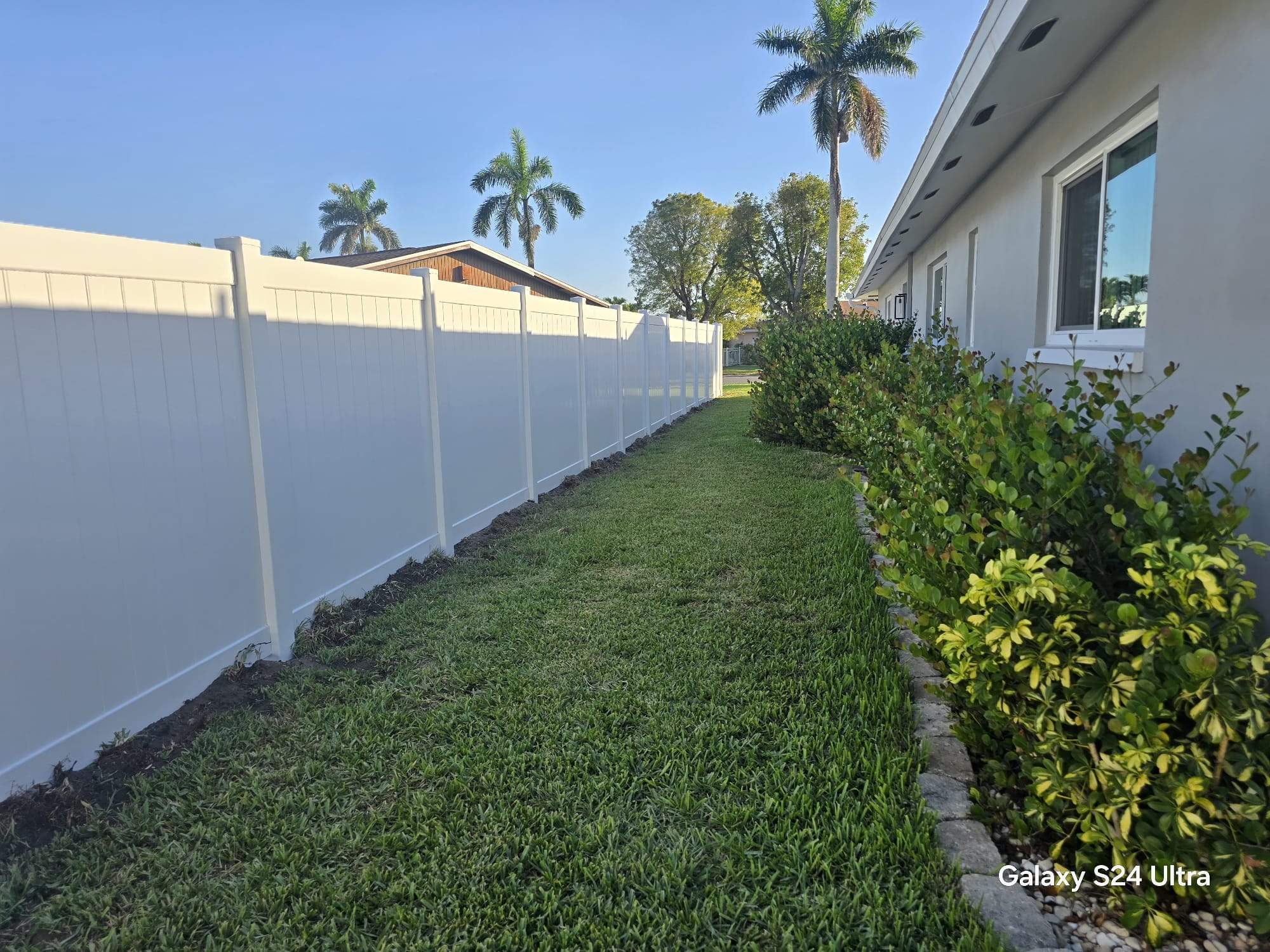 White Vinyl Privacy Fence and Double Gate Installation in Fort Myers by True Fence LLC