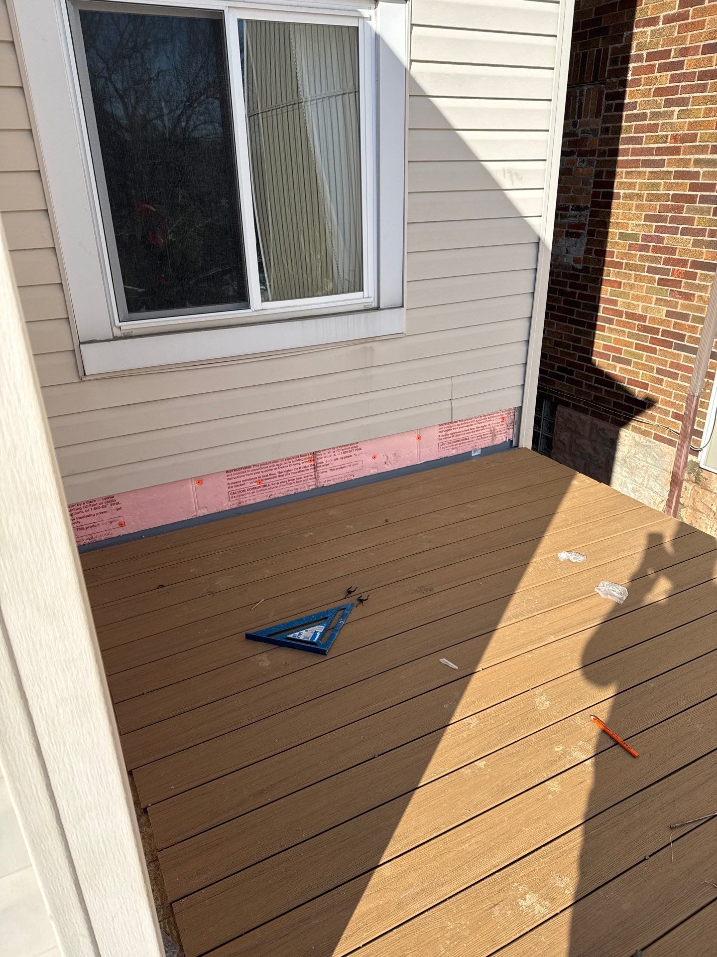 Deck and door by Cousins Roofing Siding & Decks