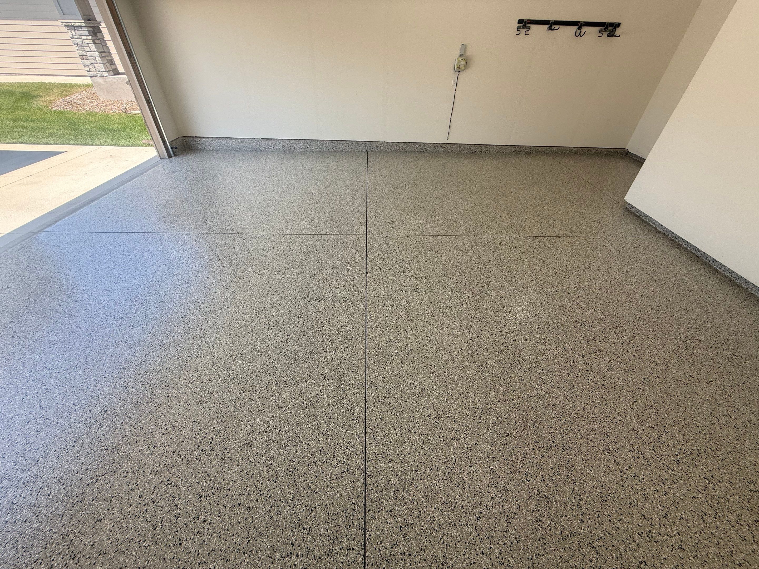 Cabin Fever Garage Floor Coating in Sioux Falls by Select Painting, Coatings & Garage Cabinets