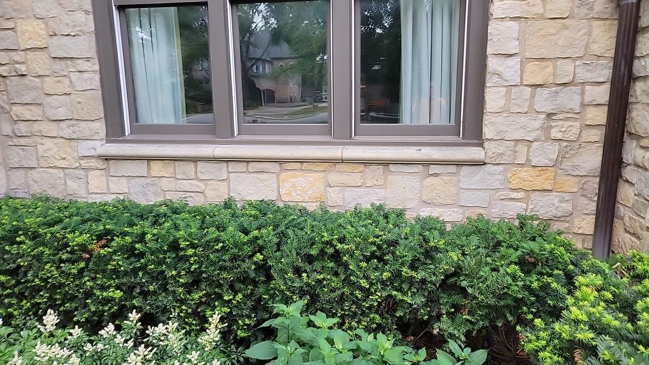 Northbrook, IL stucco home soft wash and stone cleaning by Northern Power Washing LLC.