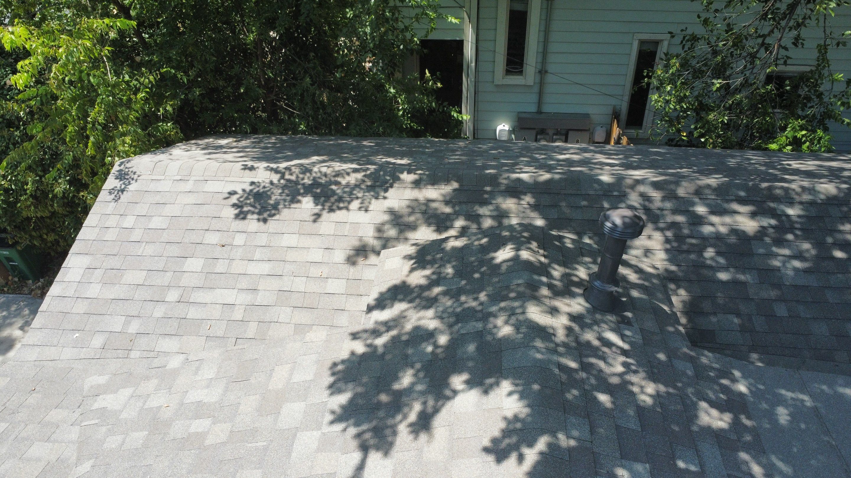 Mixed Roof System ā Oakridge Driftwood + Flat Roof Section | Austin, TX by Kstylez Roofing & Construction