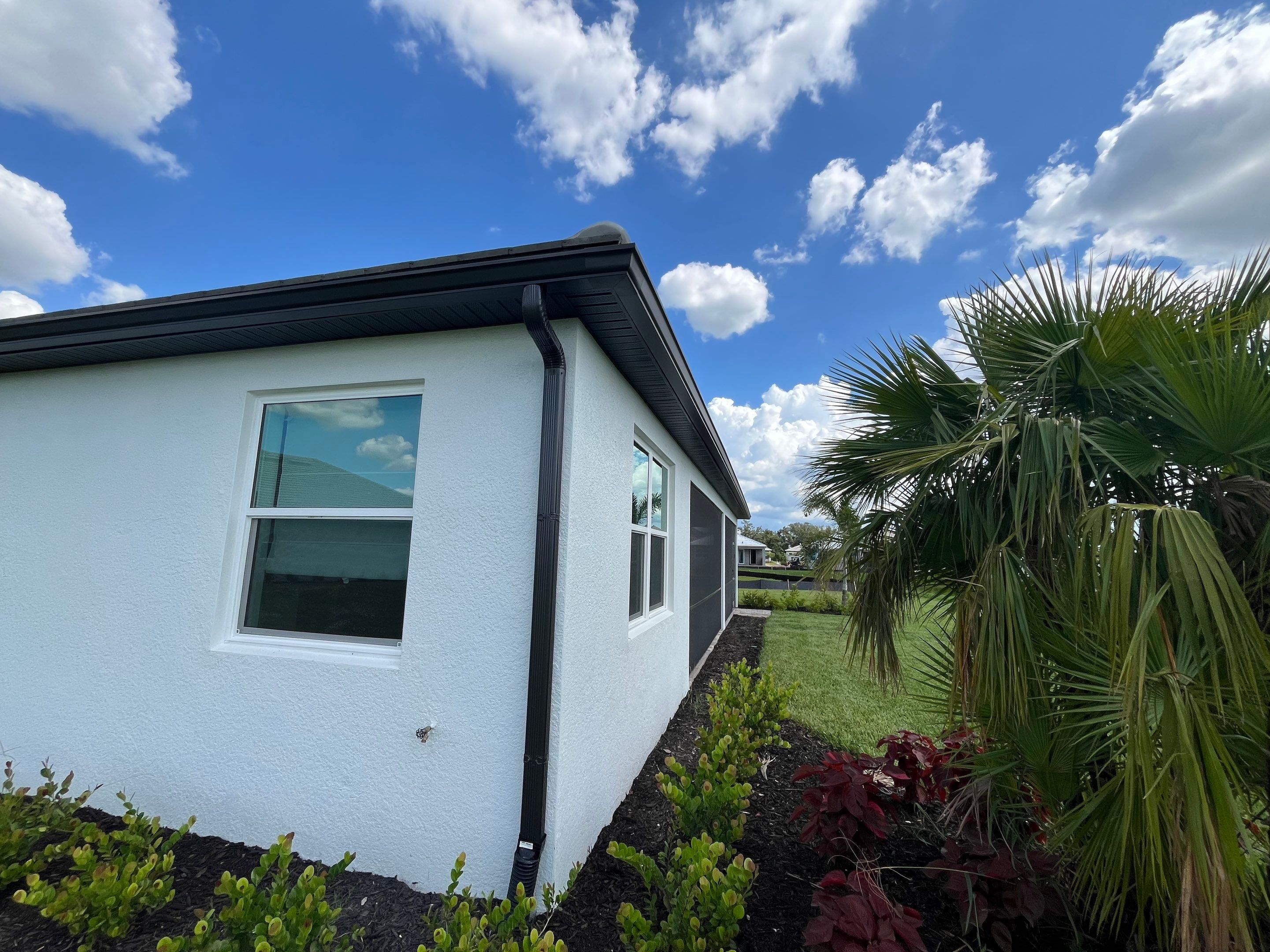 Modern Black Bronze Seamless Gutters for a Stylish Home by Gutter Professors