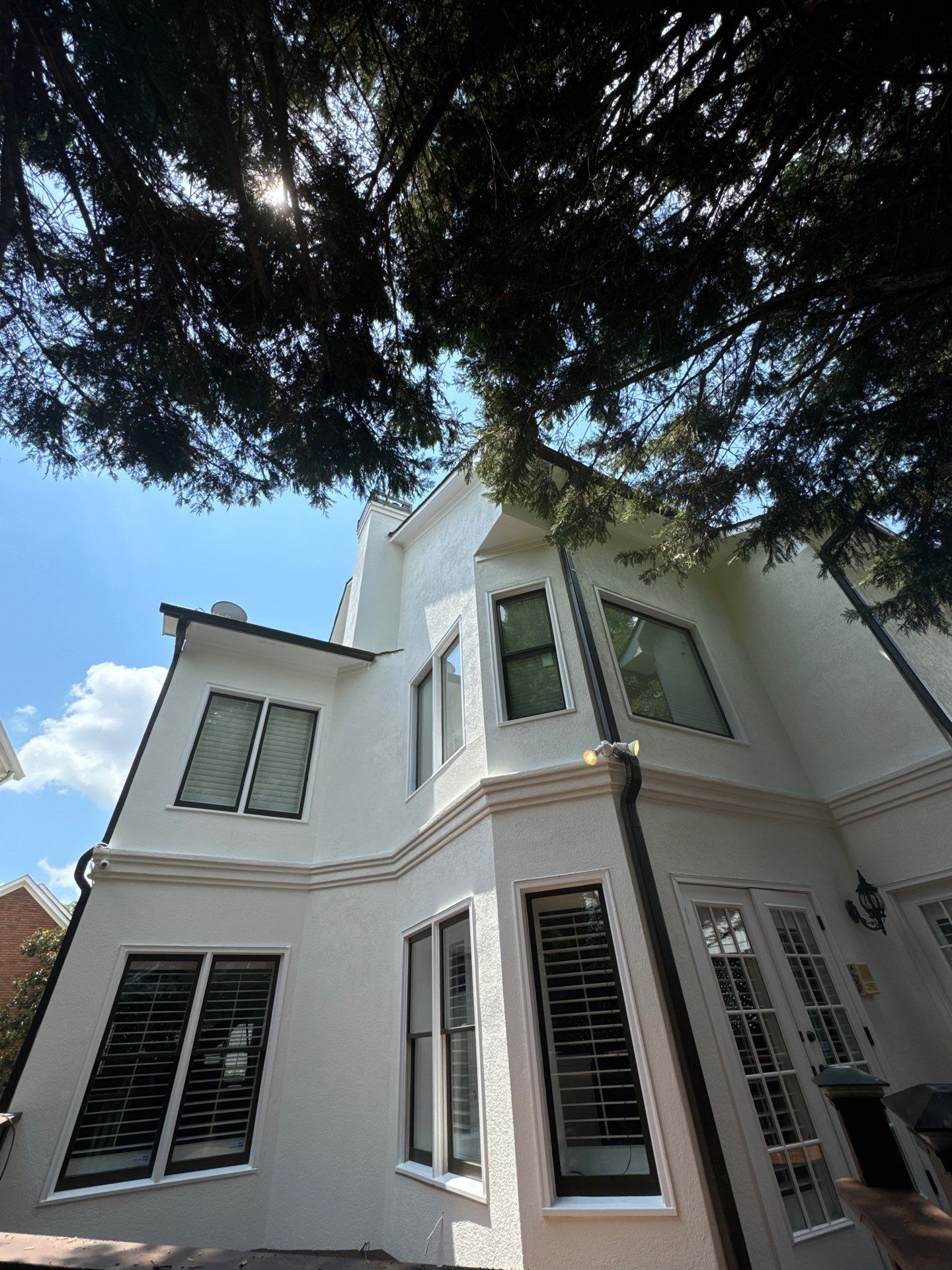 Full Exterior Stucco Painting and Wood Deck Staining in Atlanta by Swift Home Renovations