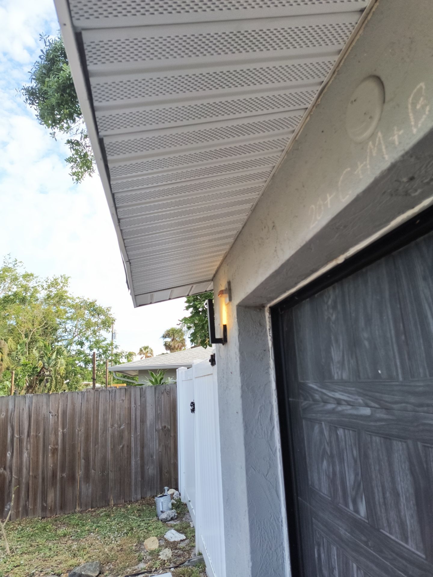 Black Seamless Gutters using 7 inch seamless gutters & New White Soffit in Sarasota FL by Gutter Professors