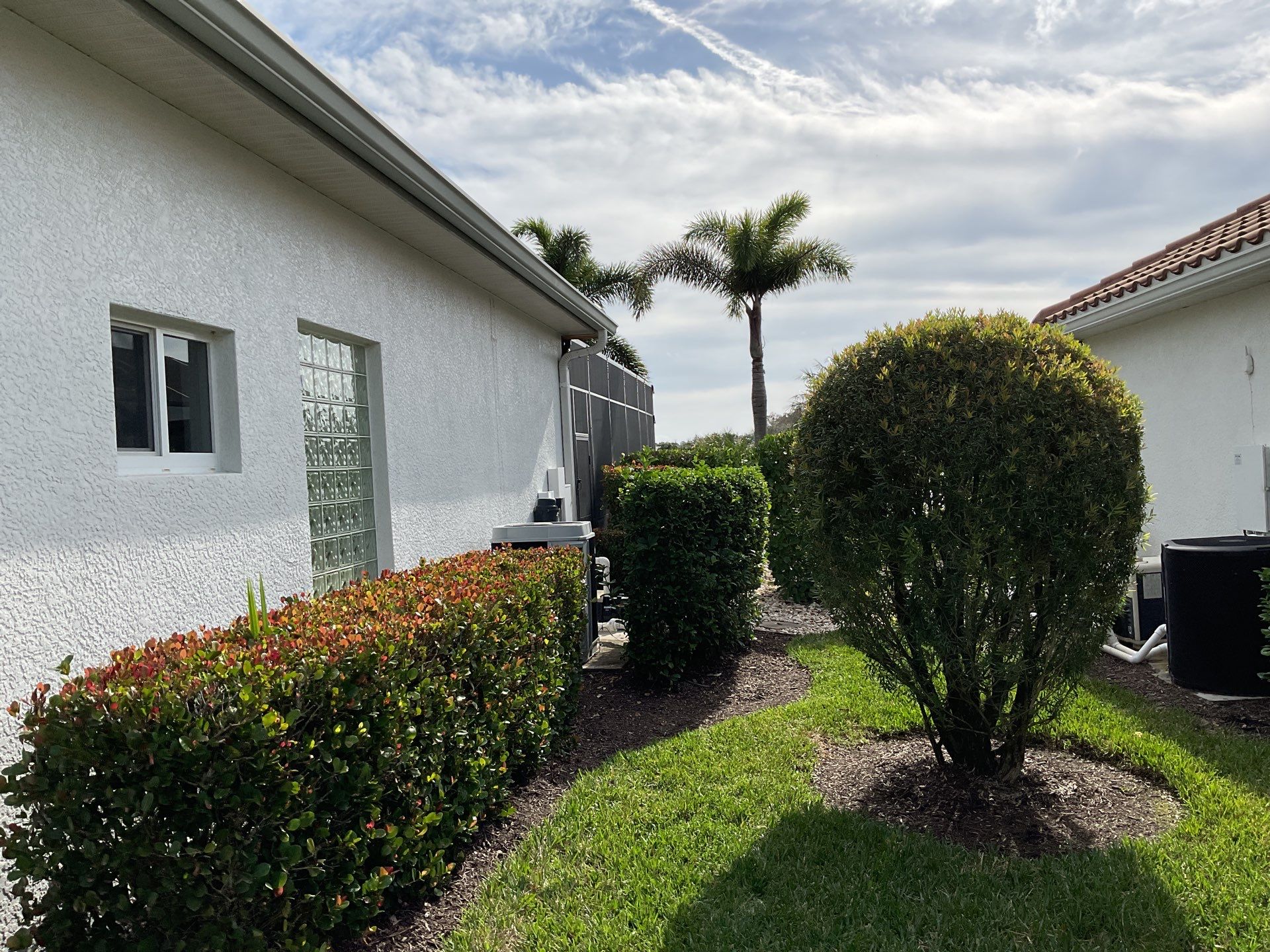 7-inch Grey Gutter Installation and White Downspouts in Fort Myers FL  by Gutter Professors