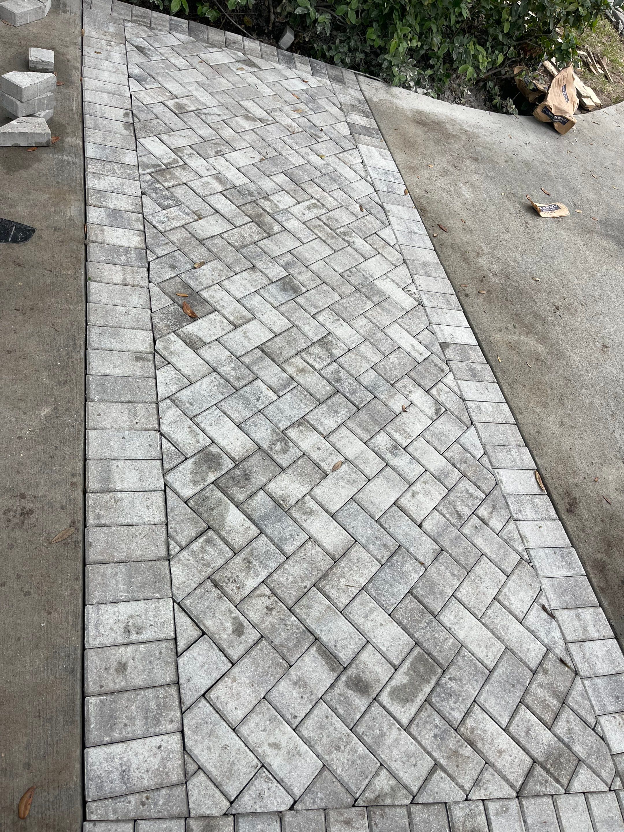 Custom Concrete Driveway with Decorative Paver Inlays in Hilton Head Island by Lowcountry Scapes, LLC