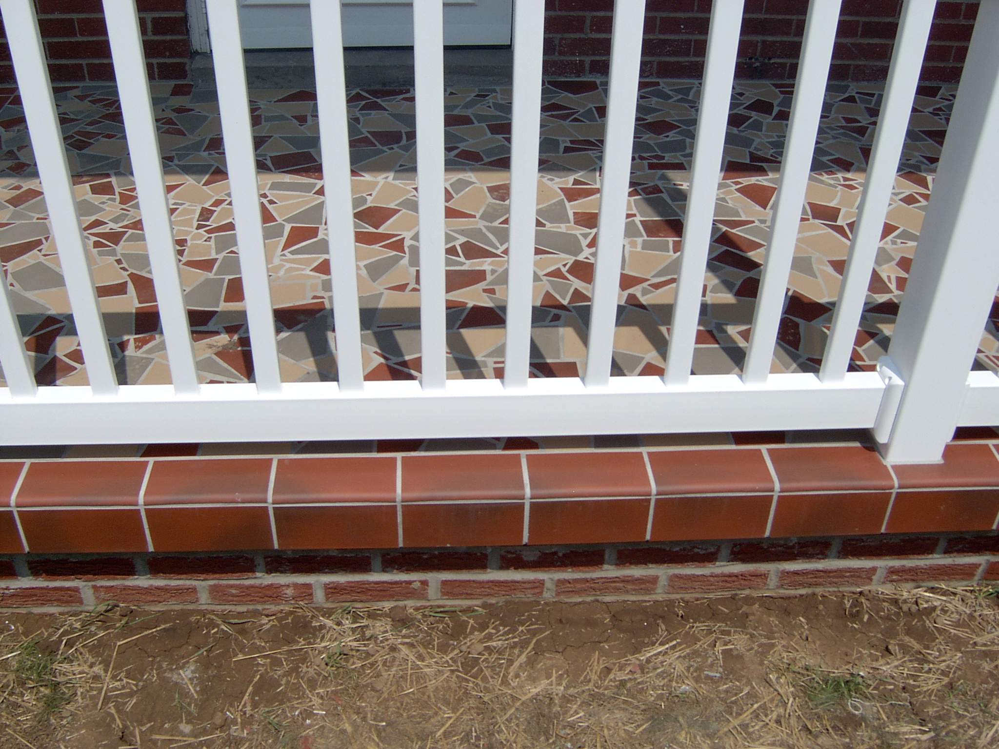 New front porch build, with tile floor and vinyl railing. by Secure Construction Company Inc