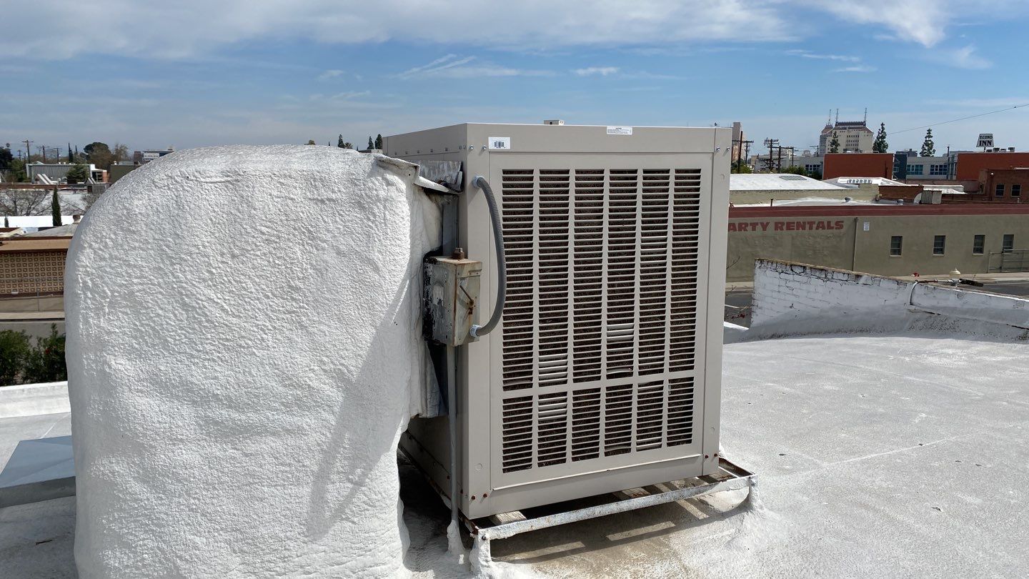 Polyurethane foam roof refurbish and recoating by Straight Edge Roofing Inc