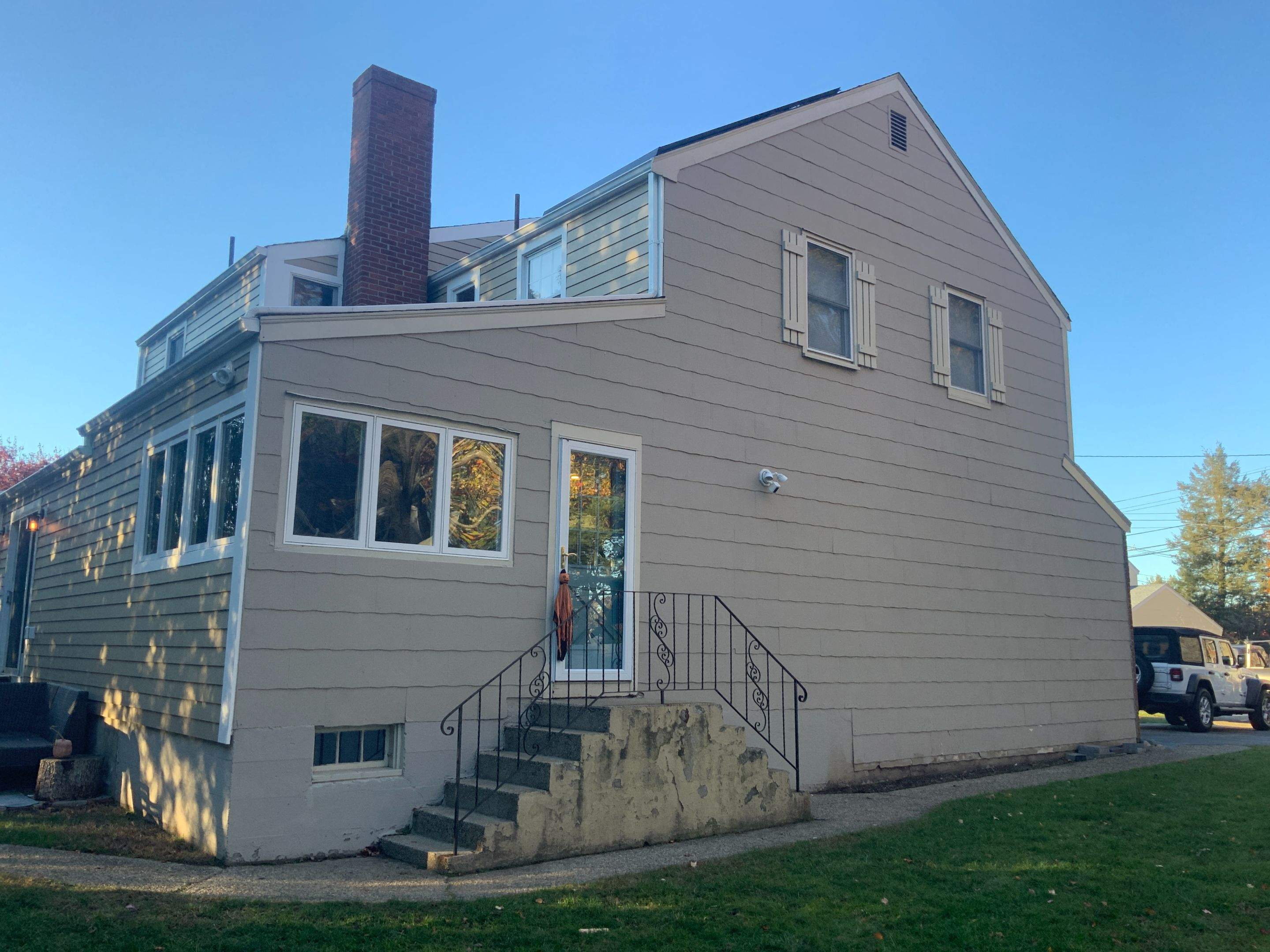 James Hardie siding, new metal roof and couple windows being installed. by UBrothers Construction