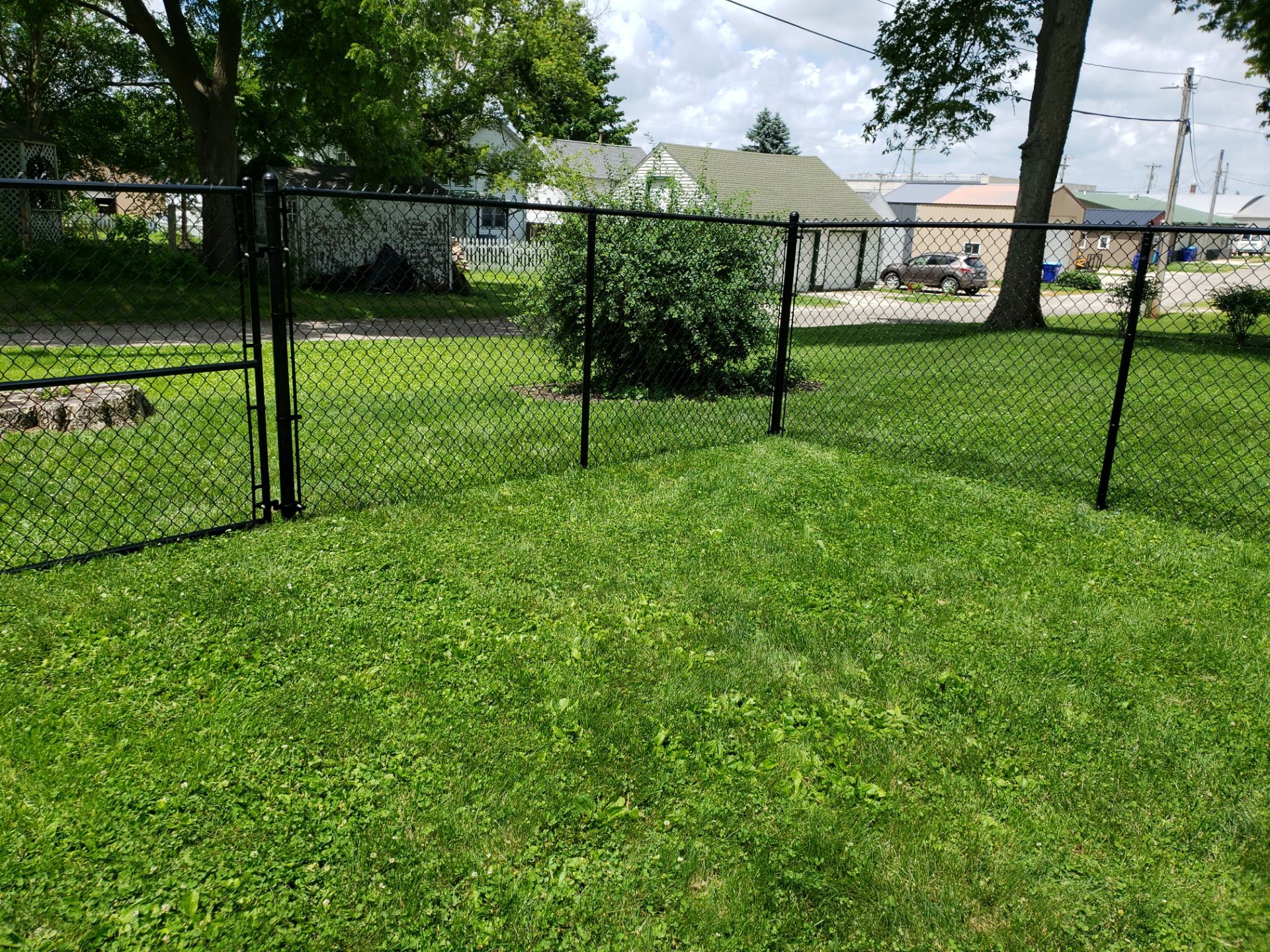 Black Vinyl Coated Chain Link Fence Installation in Independence by Perfect Picket Fence and Stain