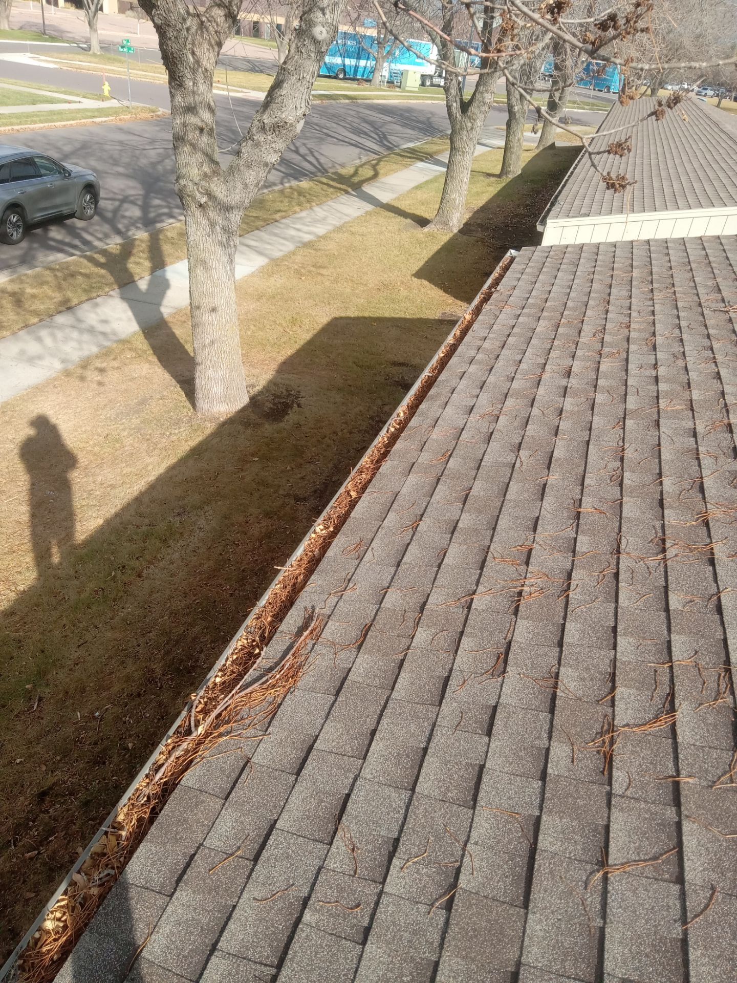 Commercial gutter cleaning South Dakota before photo with filled gutters